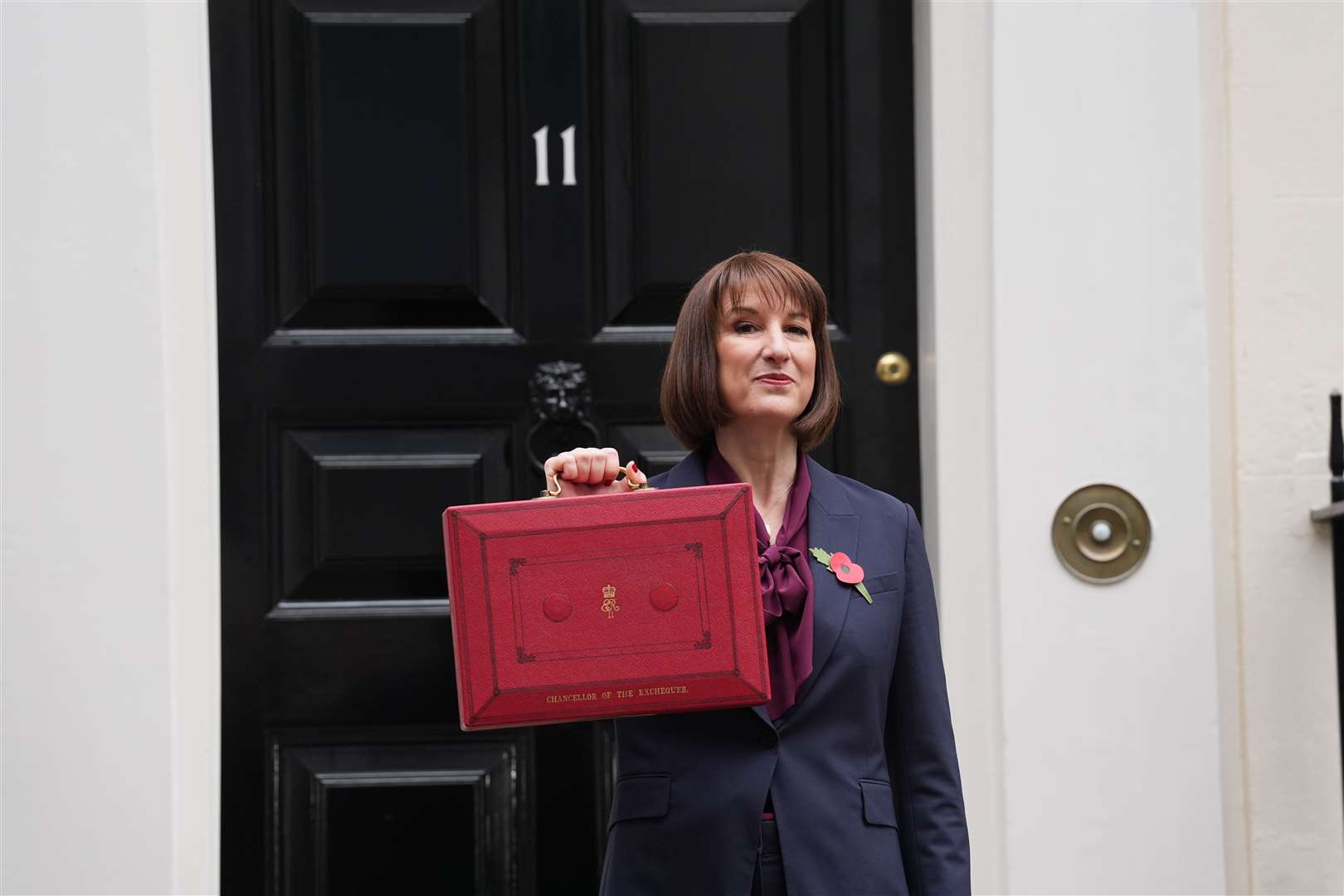 Rachel Reeves poses outside 11 Downing Street before becoming the first woman to deliver a Budget as Chancellor of the Exchequer (Lucy North/PA)