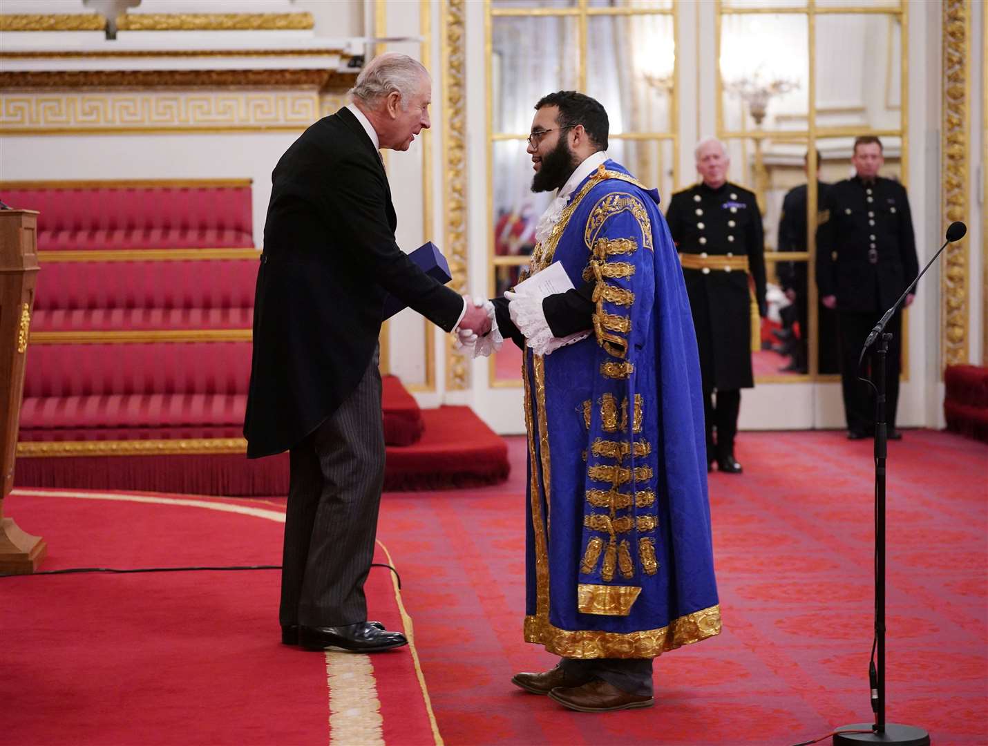 The King and Lord Mayor of Westminster Hamza Taouzzale during a presentation of loyal addresses by the privileged bodies, at a ceremony at Buckingham Palace in London (Yui Mok/PA)