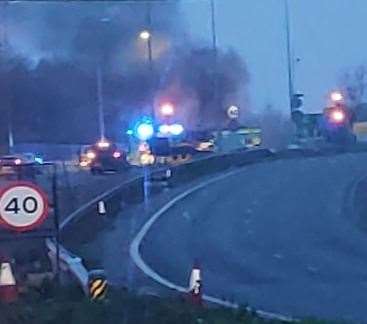 The roundabout off Junction 10 of the M20 has been sealed off by police