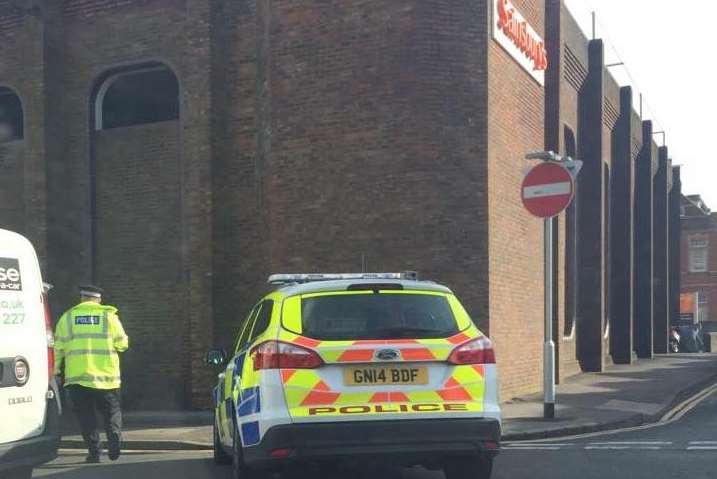 Officers have closed the road outside Sainsbury's