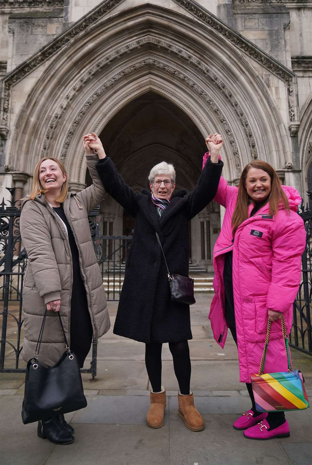 Former subpostmistress Kathleen Crane outside the Royal Courts of Justice with her daughters Lucy (left) and Katy (Yui Mok/PA)