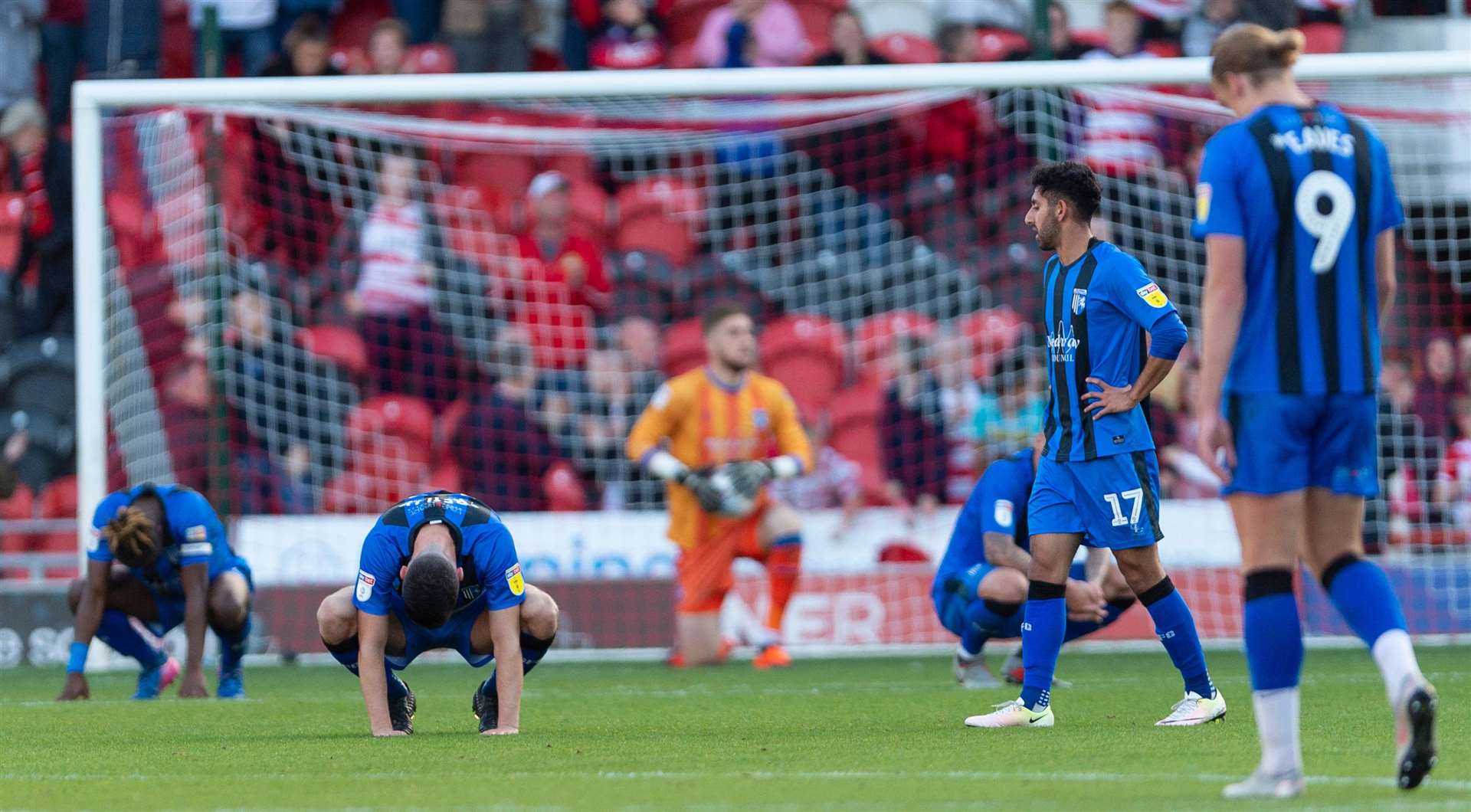 Gills players are left deflated after conceding an injury-time equaliser at Doncaster. Picture: Ady Kerry