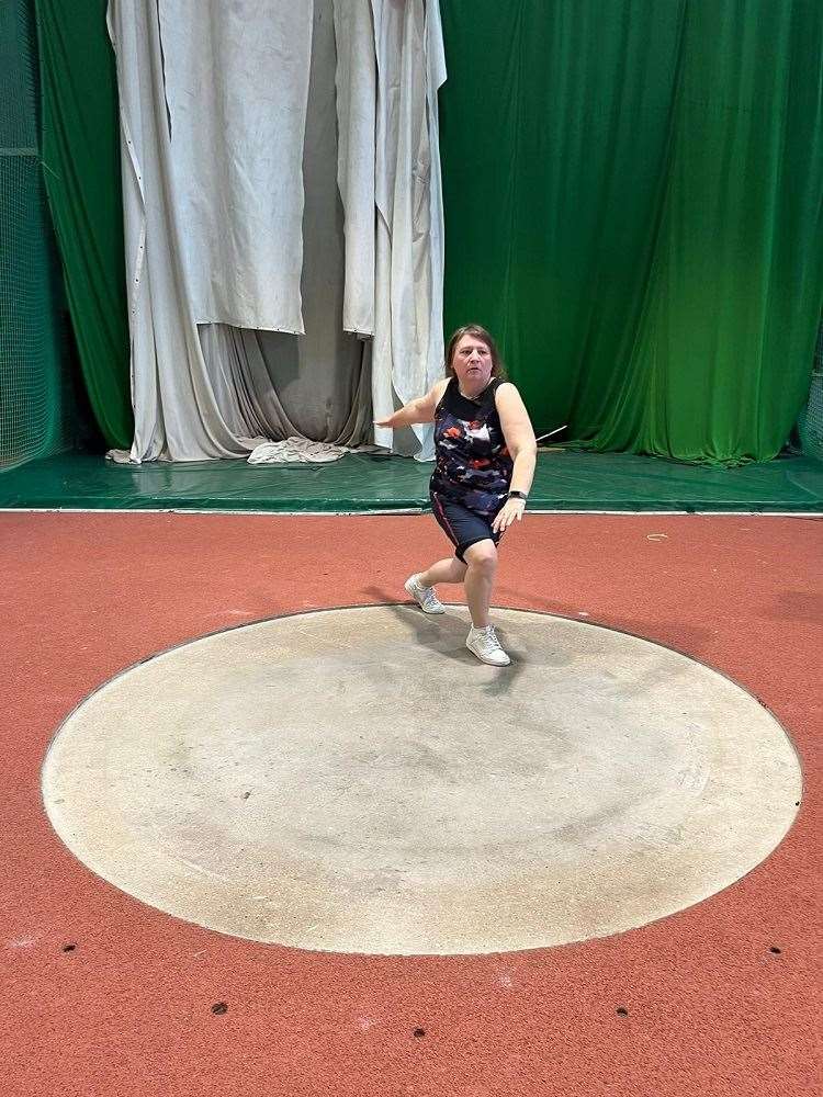 Denise Kidger practises throwing the discus (Denise Kidger/PA)