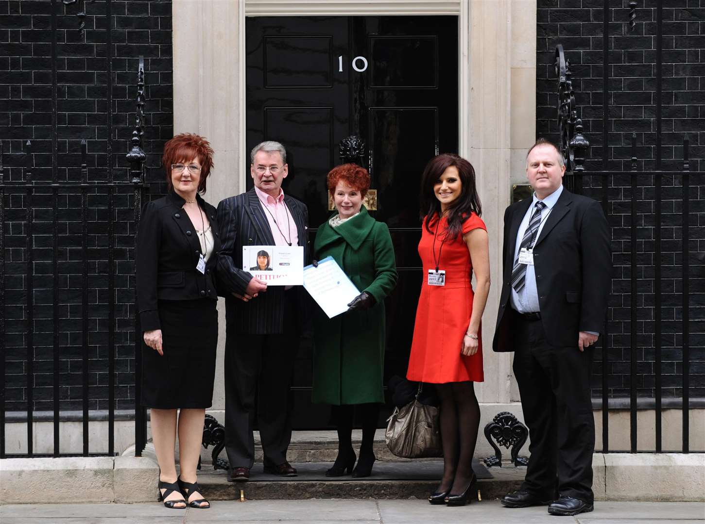 Michael Brown (second left) and (L to R) Mr Brown’s partner Elizabeth Betts, Labour MP Hazel Blears, Michelle Livesey of radio station Key 103, and Clare Wood’s brother Adam Brown-Wilkinson handing in a petition at 10 Downing Street (Dominic Lipinski/PA)