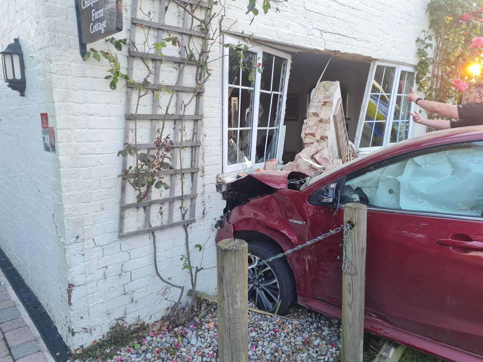 The red Toyota Yaris left a gaping hole in the front of the property