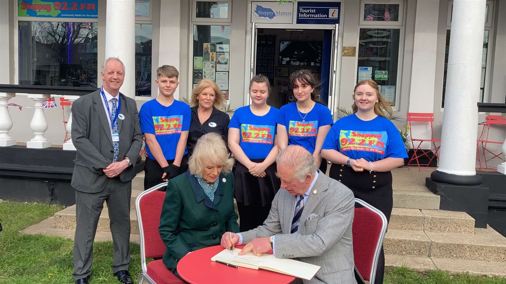 Royal couple Prince Charles and Camilla Duchess of Cornwall sign the Sheppey Matters' visitors' book outside the Sheppey FM studios at Sheerness. Picture: John Nurden