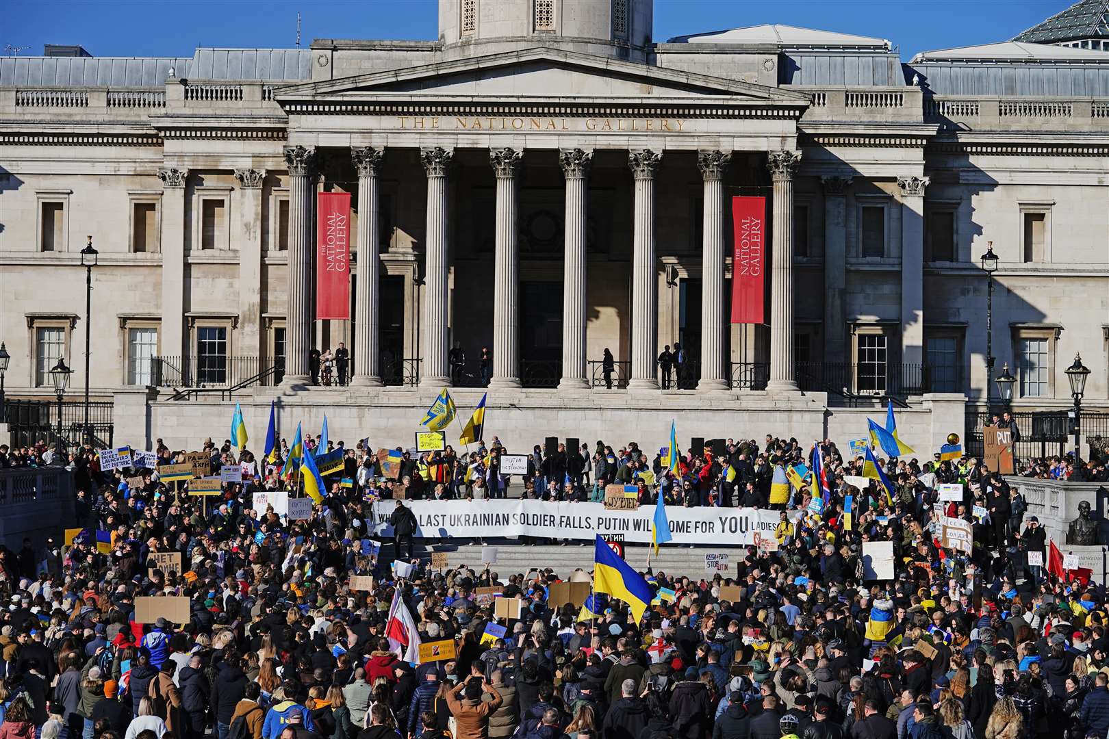 People take part in a demonstration in Trafalgar Square, London, to denounce the Russian invasion of Ukraine (Aaron Chown/PA)