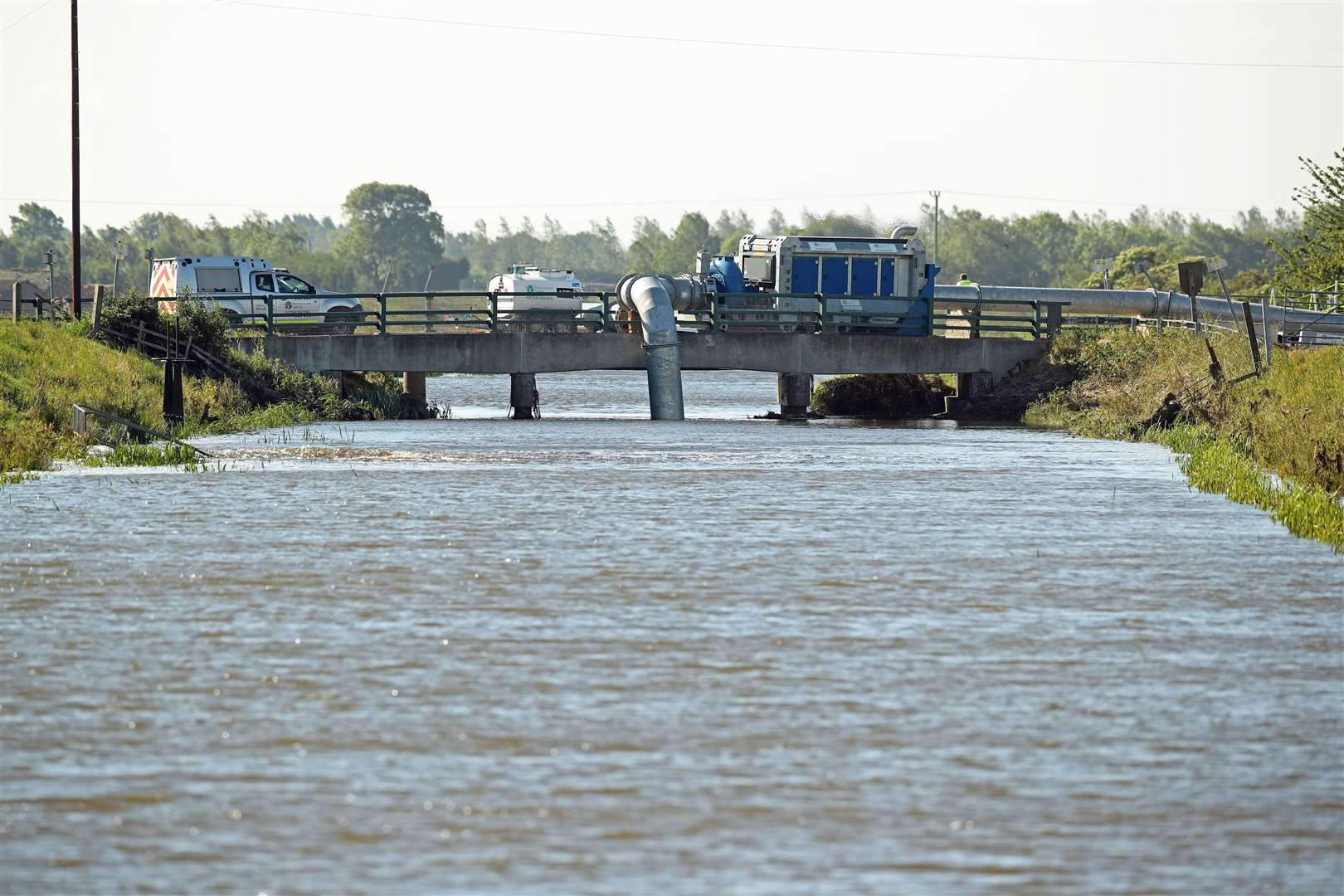 High-volume pumps are being used to pump flood water back into the steeping river in Lincolnshire, where streets and properties flooded after the town had more than two months of rain in just two days (Danny Lawson/PA)