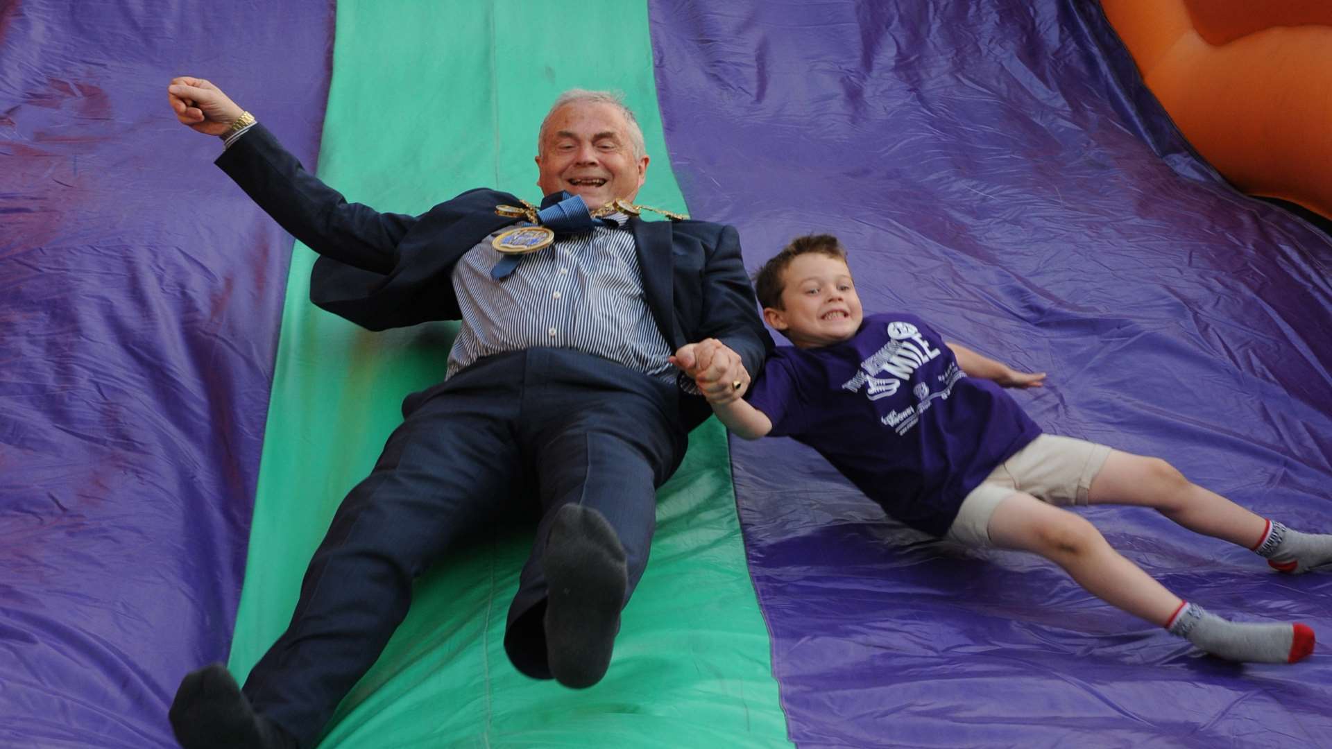 Mayor of Medway Cllr, Stuart Tranter and grandson Josh Barker, four having fun on the slide