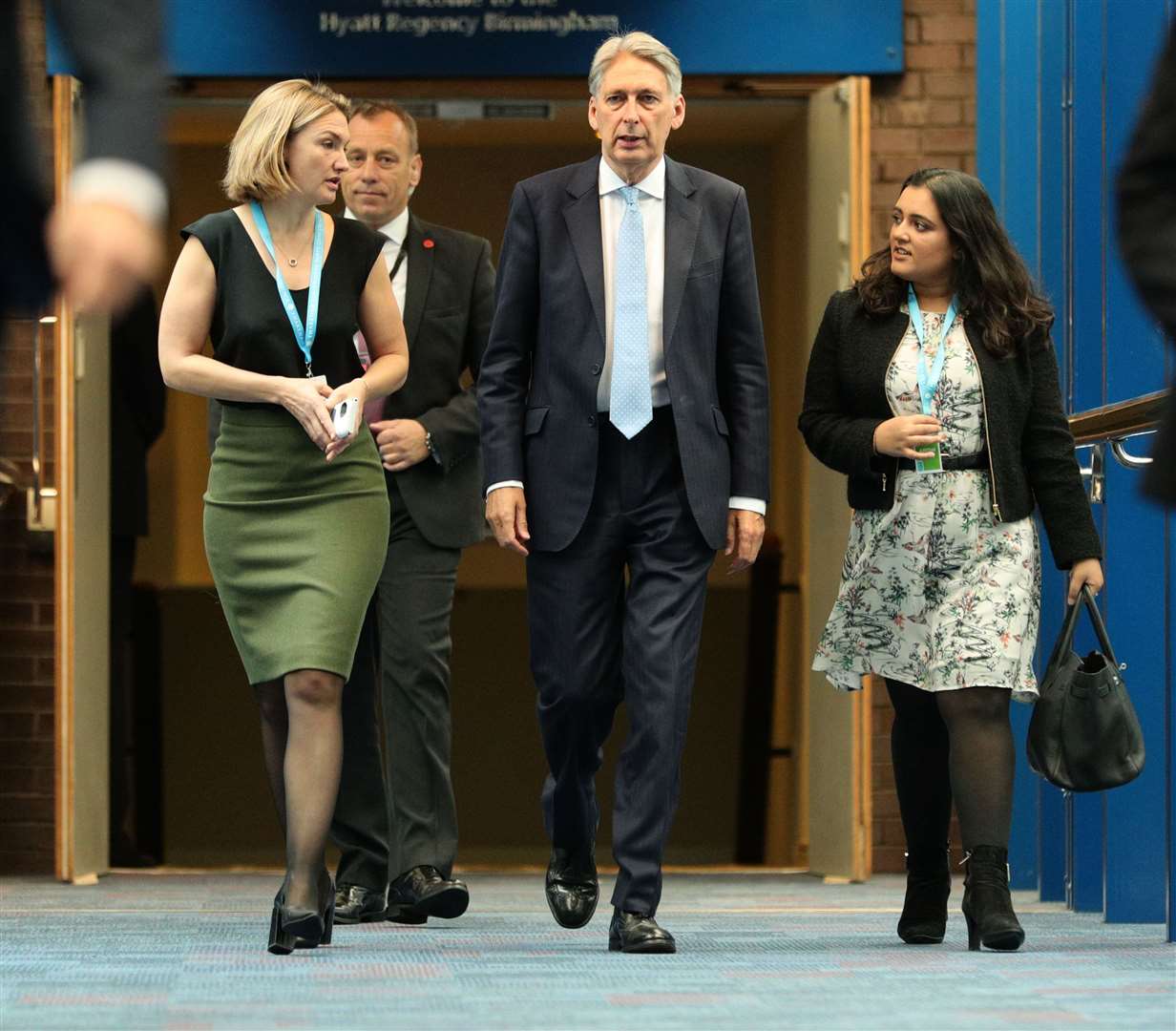 Former chancellor Philip Hammond walks with aides Poppy Trowbridge (left) and Sonia Khan (right) (Aaron Chown/PA)