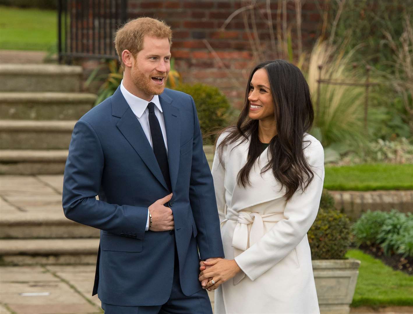 Prince Harry and Meghan Markle in the Sunken Garden at Kensington Palace after the announcement of their engagement (Dominic Lipinski/PA)