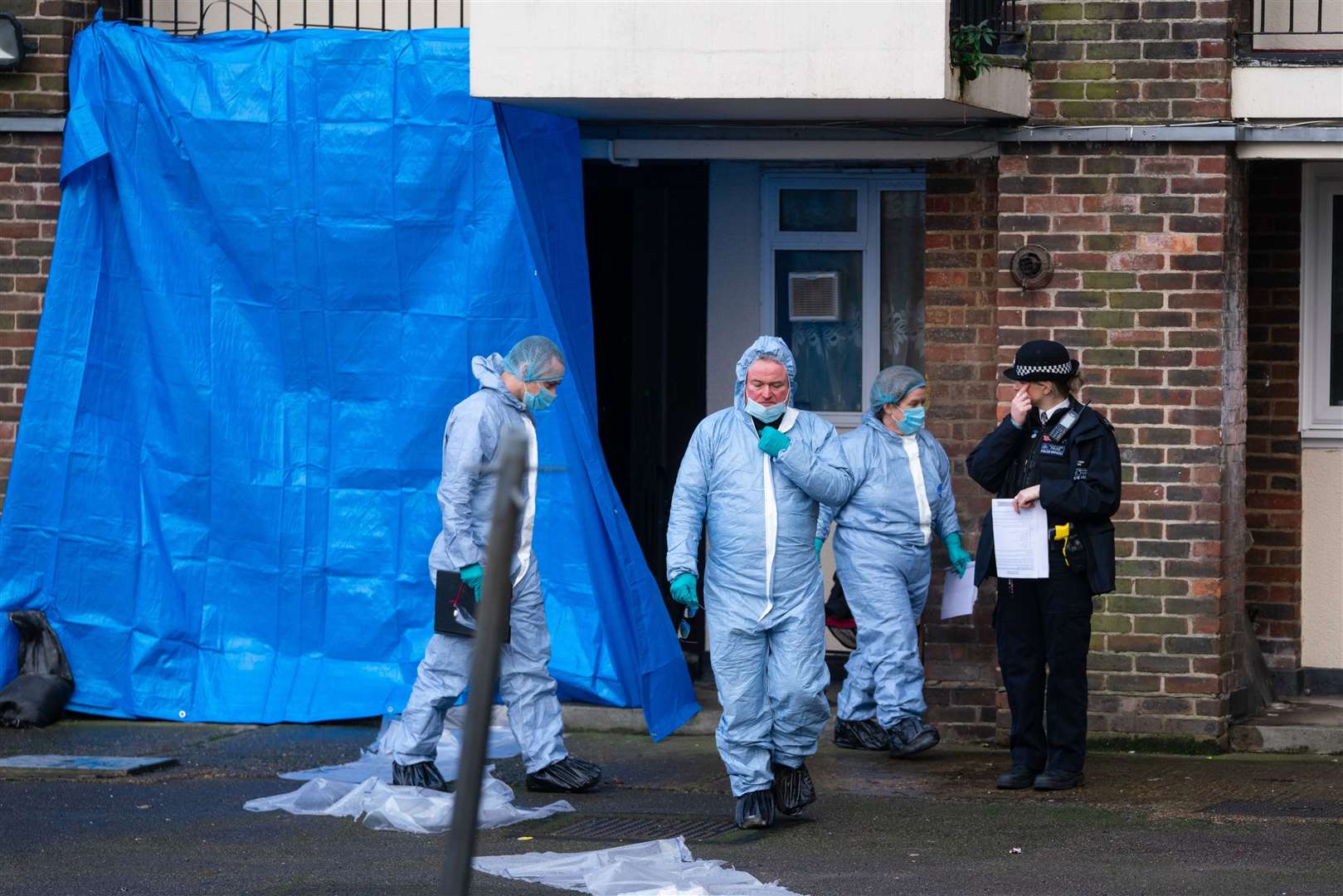 Police forensics officers investigate the scene (Dominic Lipinski/PA)