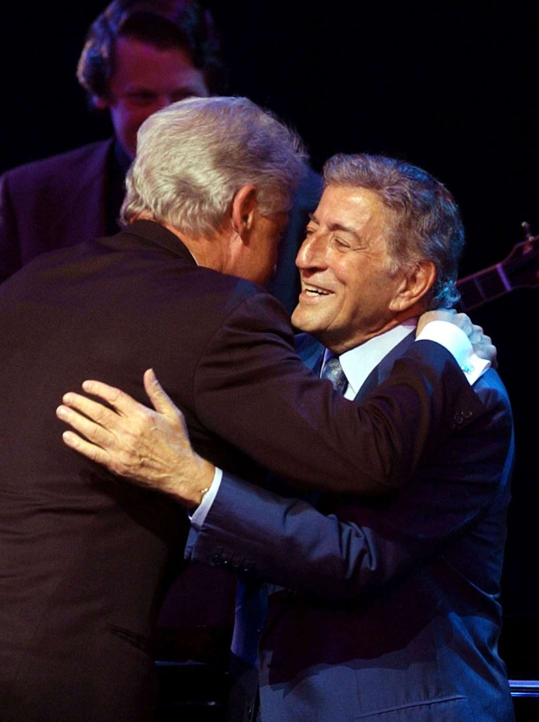 Singer Tony Bennett receives a hug from former US president Bill Clinton during A Night At The Apollo (Stan Honda/PA)