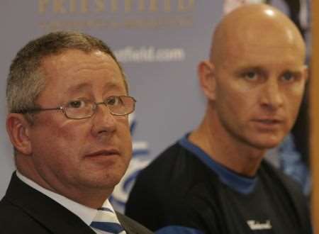 Gillingham chairman Paul Scally has opened compensation talks with former boss Mark Stimson