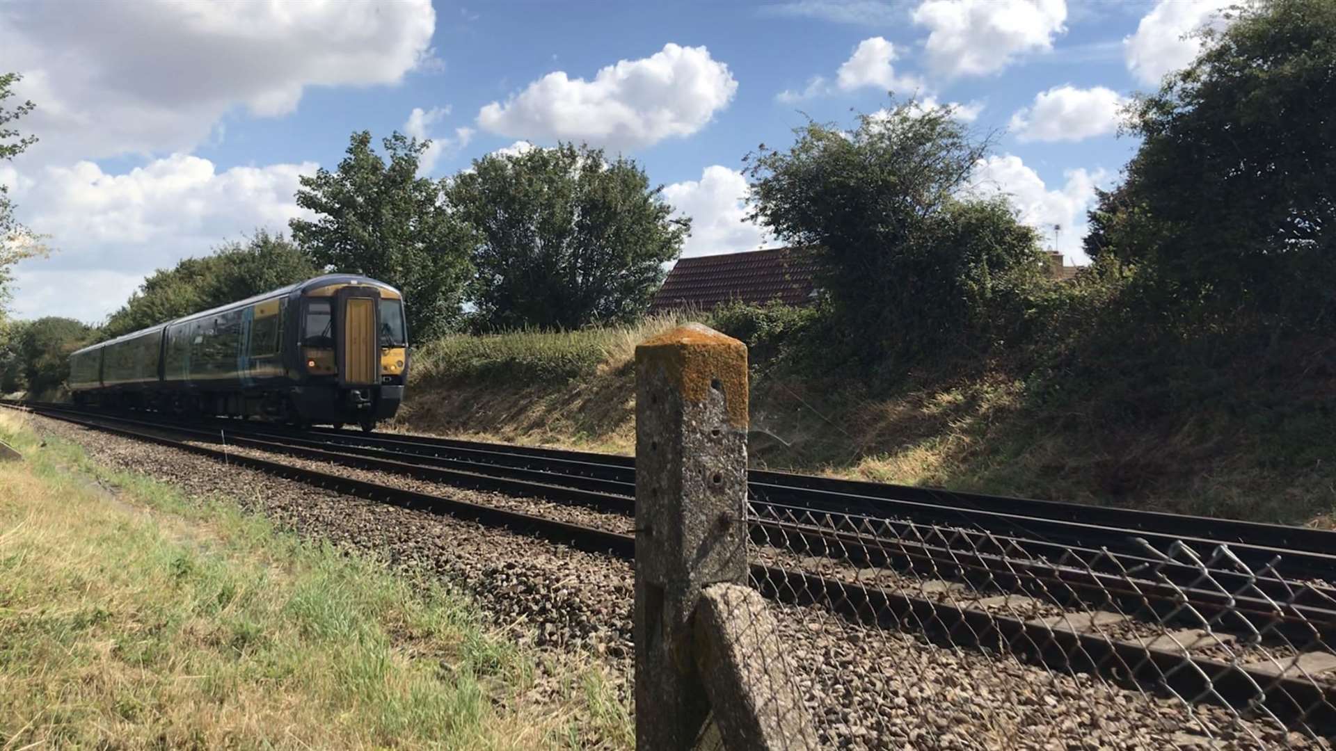 A train passing the pedestrian crossing between Volante Drive and Middletune Avenue in Milton Regis, Sittingbourne (39857972)