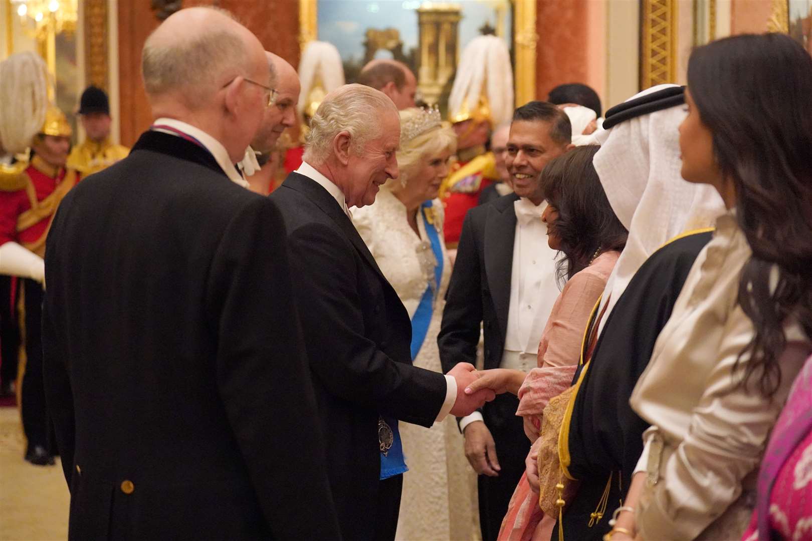 The King and Queen greeting guests in 2023 (Jonathan Brady/PA)