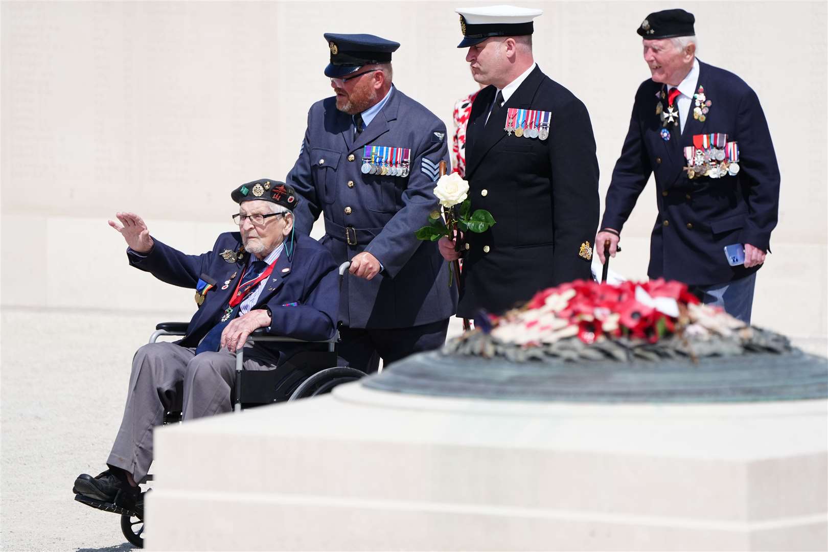 Veterans are escorted at the end of the UK national commemorative event (Jane Barlow/PA)