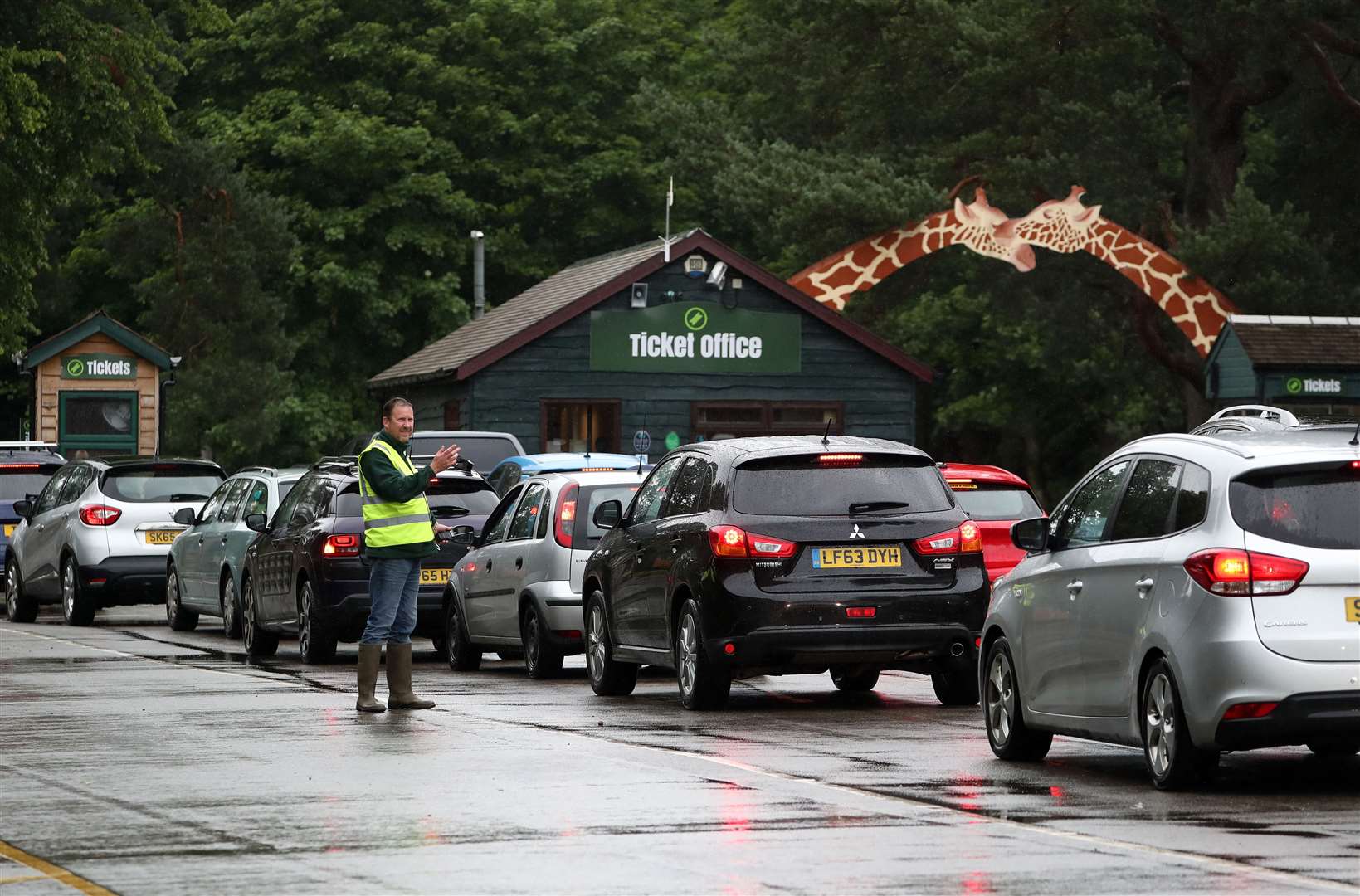 Staff direct traffic as visitors queue to enter the park (Andrew Milligan/PA)