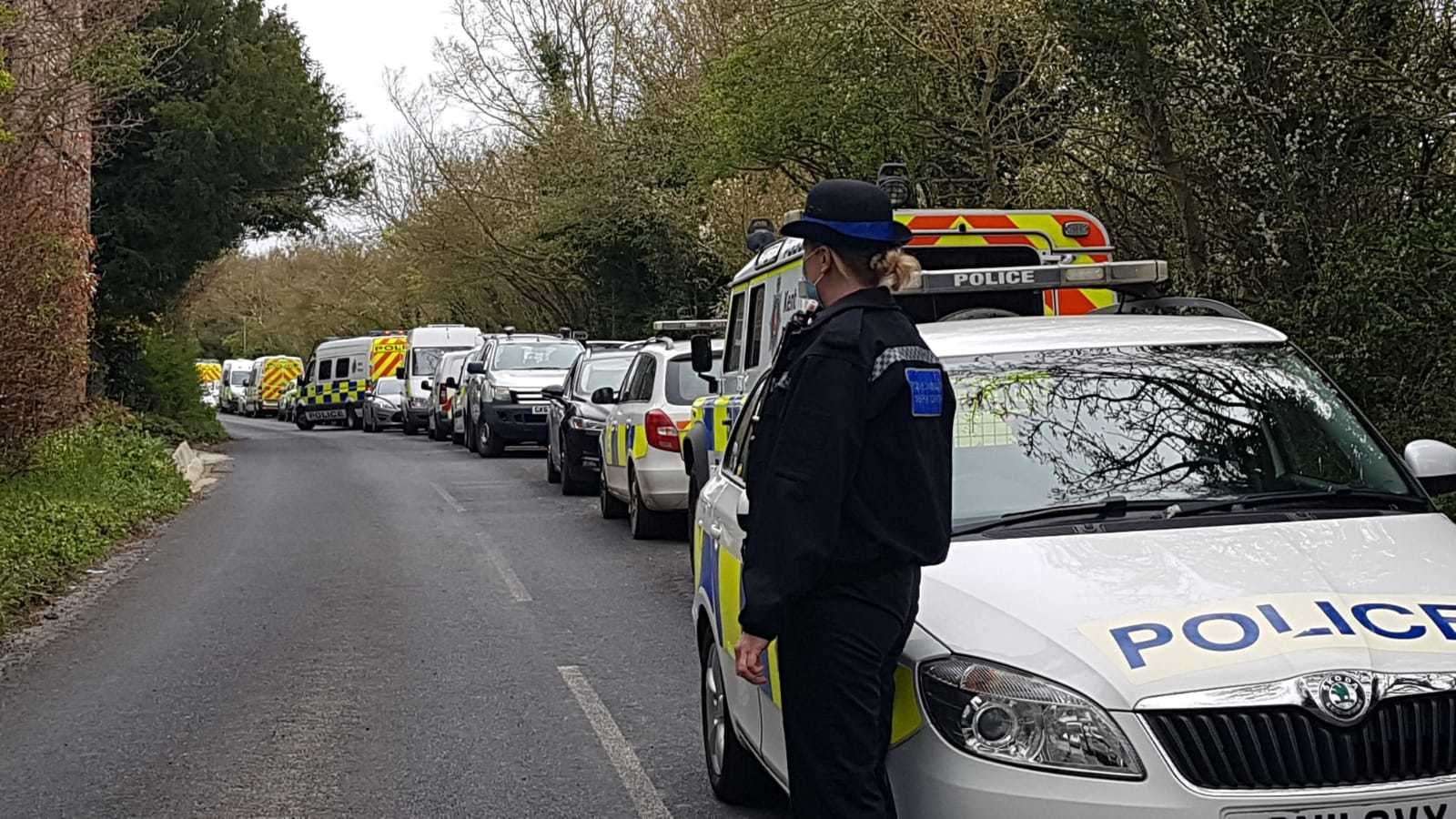 Police vehicles lined up along Aylesham Road