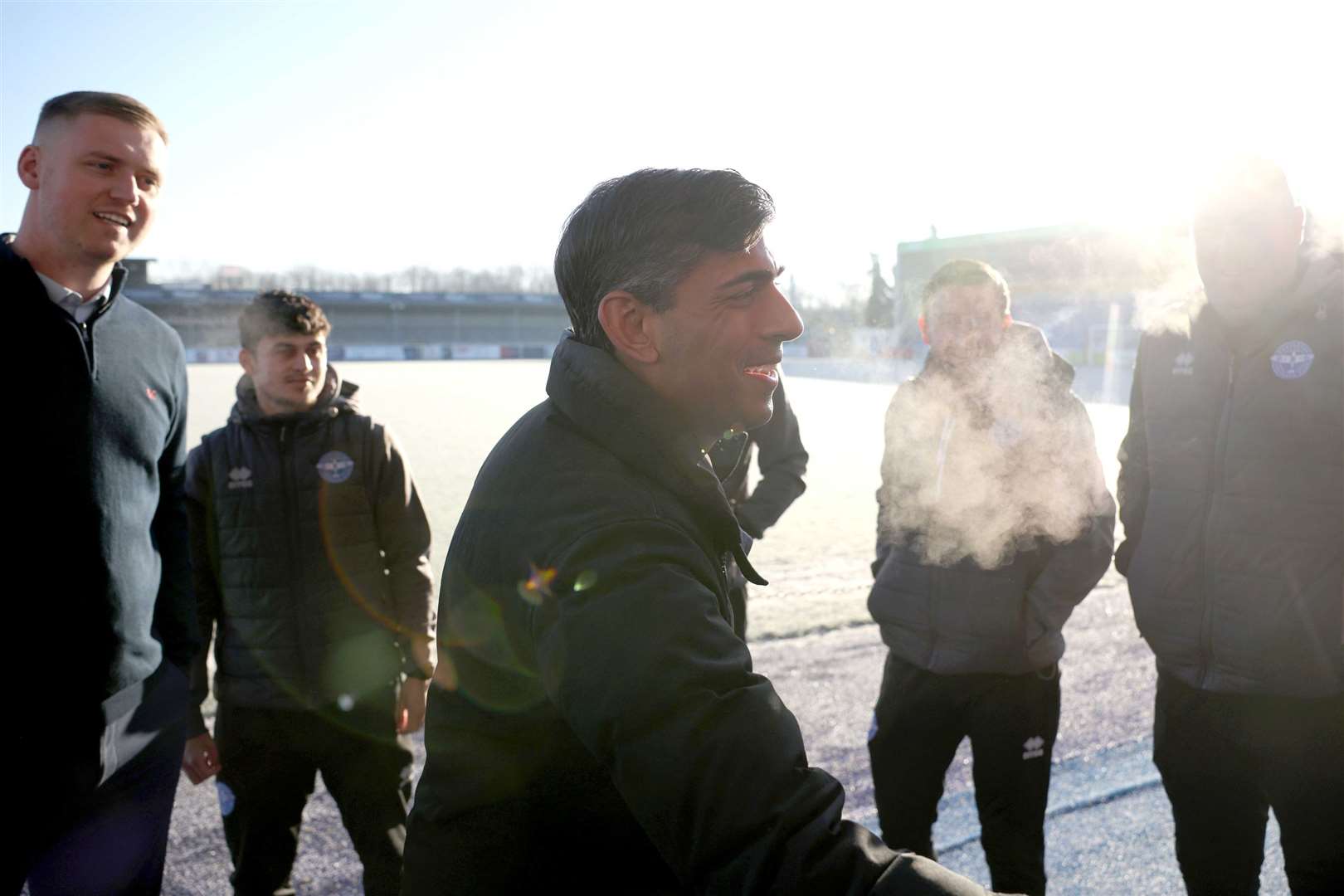 Prime Minister Rishi Sunak speaks to Eastleigh FC players and staff during a visit to the team’s Silverlake Stadium (Dan Kitwood/PA)