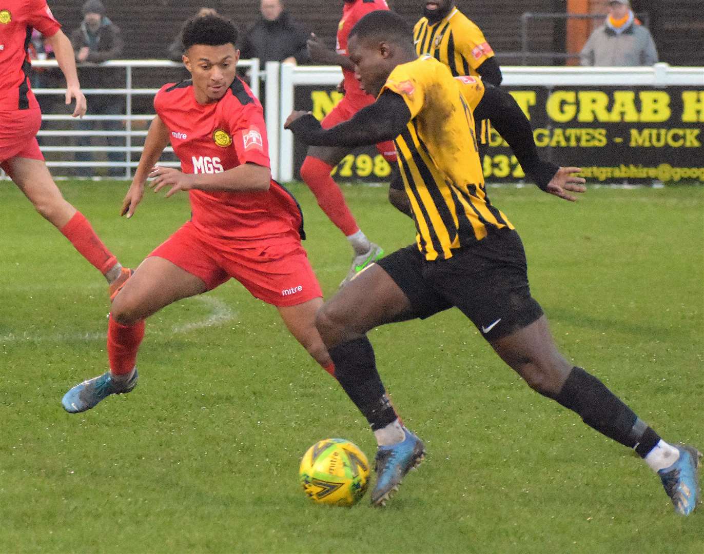 Folkestone striker Ade Yusuff drives at the Merstham defence during Invicta's 6-1 win on Monday. Picture: Randolph File