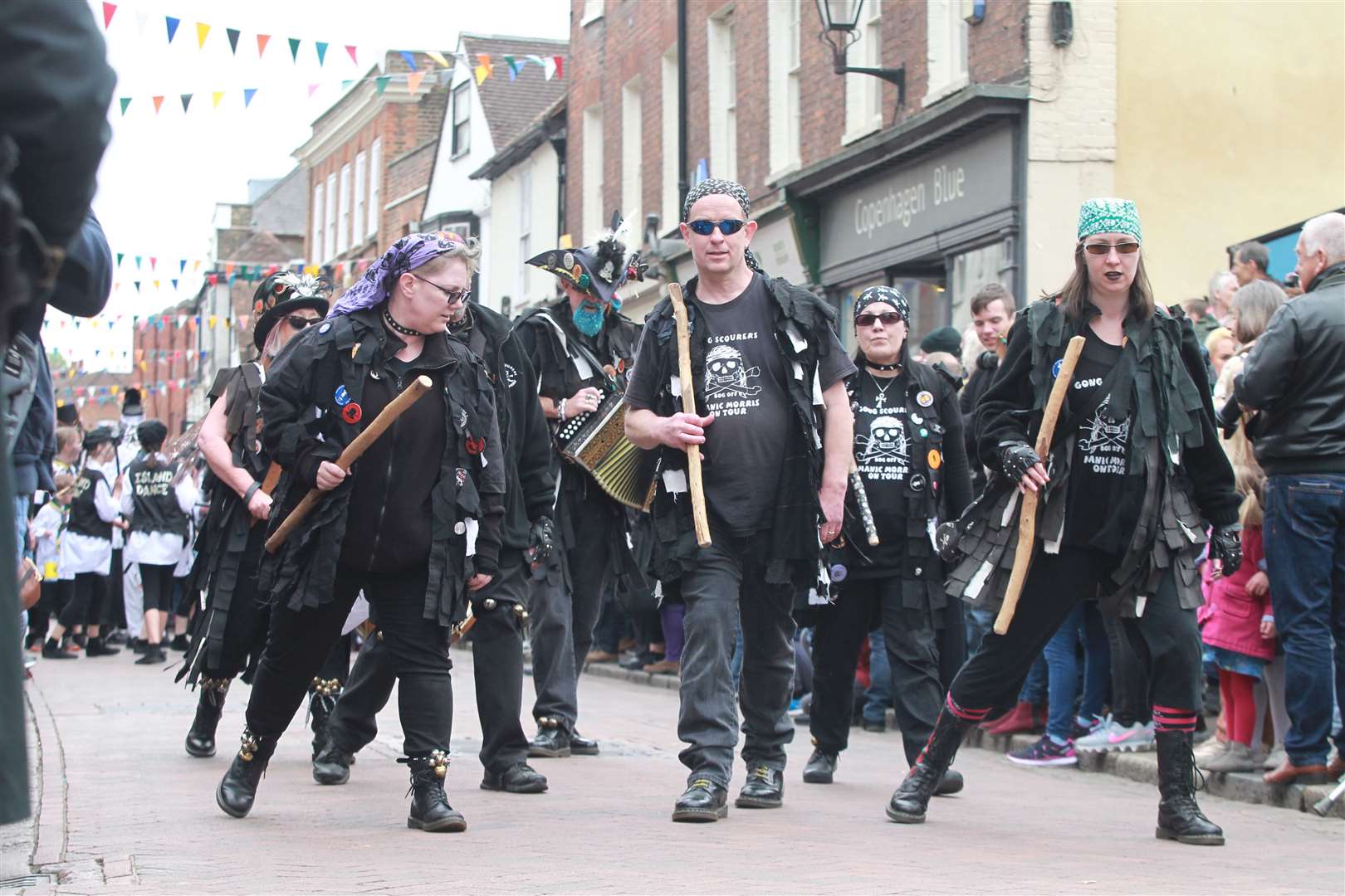 Morris dancers in a long procession through Rochester High Street at The Sweeps Festival in Rochester. Picture by: John Westhrop. (9744892)