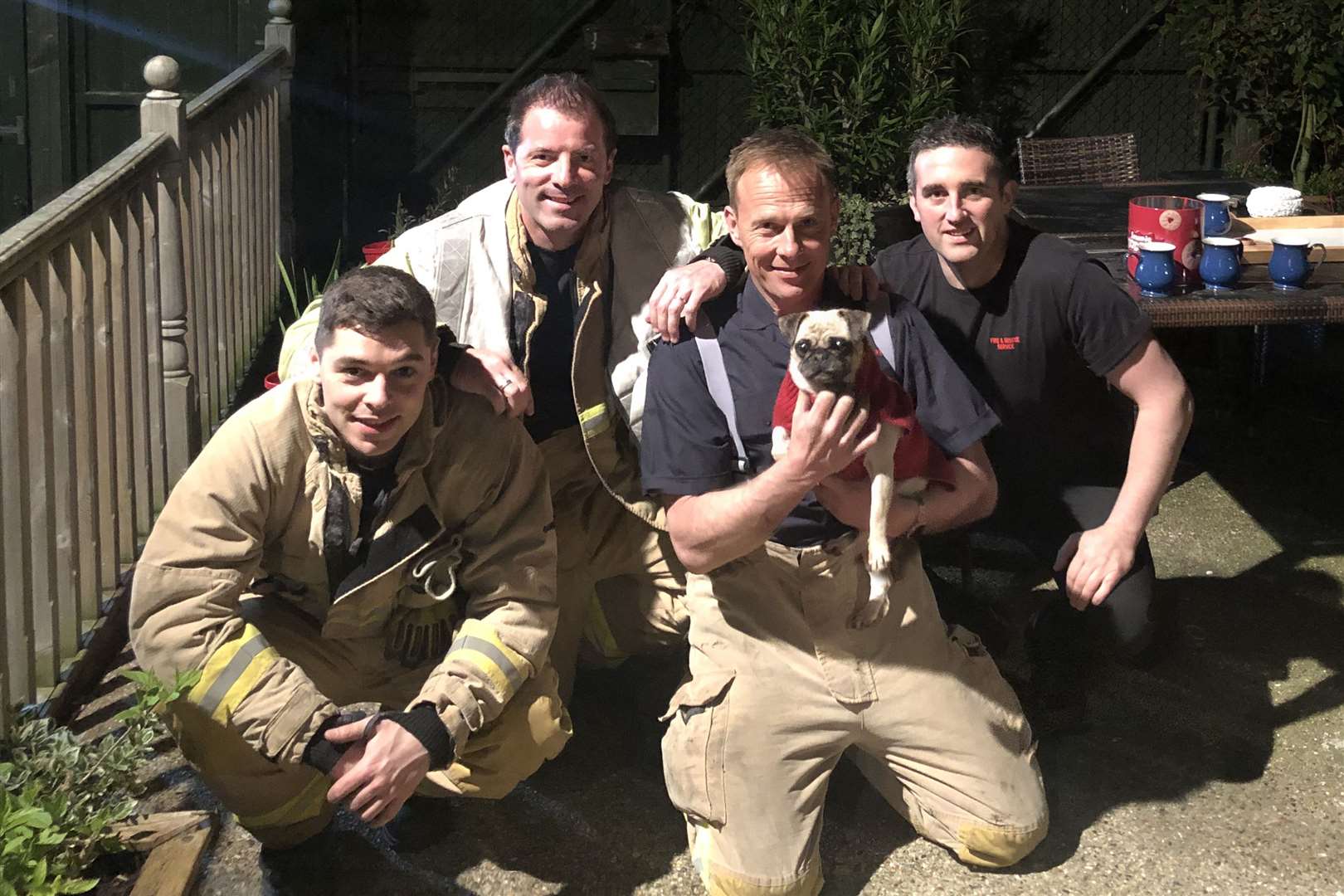 Firefighter Yousef Al-Ani, crew manager Graham Porter, firefighter Freddie Fullager, firefighter Jim Dorman after they rescued Kiki