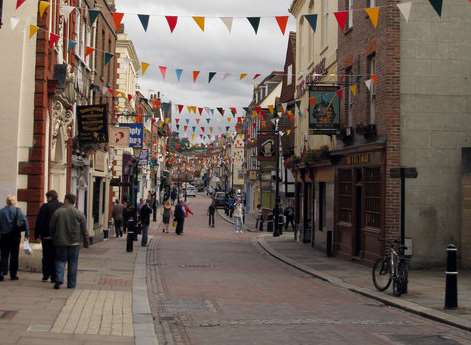 The woman was mugged in High Street, Rochester, as she walked home.