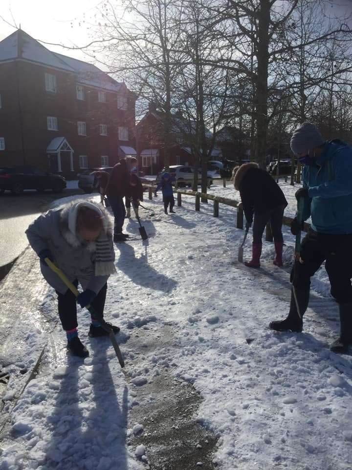Residents clearing snow and ice from Great Easthall estate at Murston, near Sittingbourne. Picture: Cllr James Hall