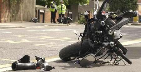 SPLIT IN TWO: The front half of the bike is in the foreground and the rear half on the other side of the road. Picture: MATT READING