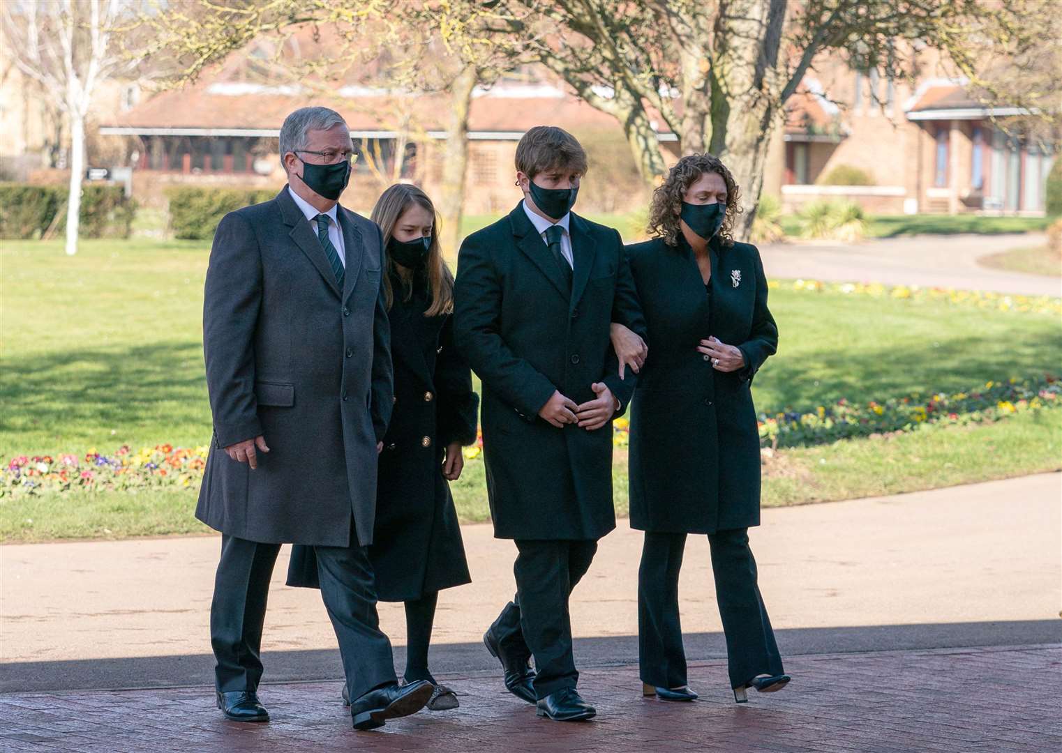 (l to r) son-in-law Colin Ingram, granddaughter Georgia, grandson Benjie and daughter Hannah Ingram-Moore arrive for the funeral (Joe Giddens/PA)