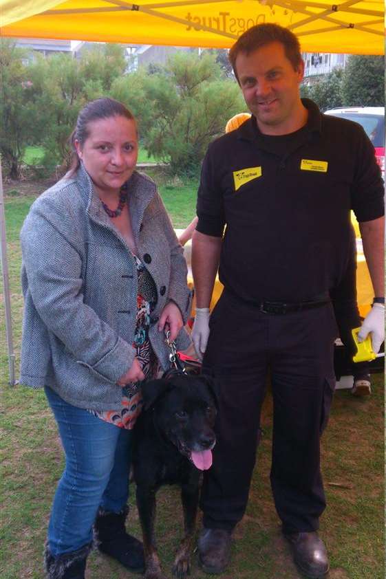 Natalie Smith with her newly micro-chipped dog Scumbag (the name he had when he was rescued) and Hamish Morrin, from The Dogs Trust. Picture: David Palmer.