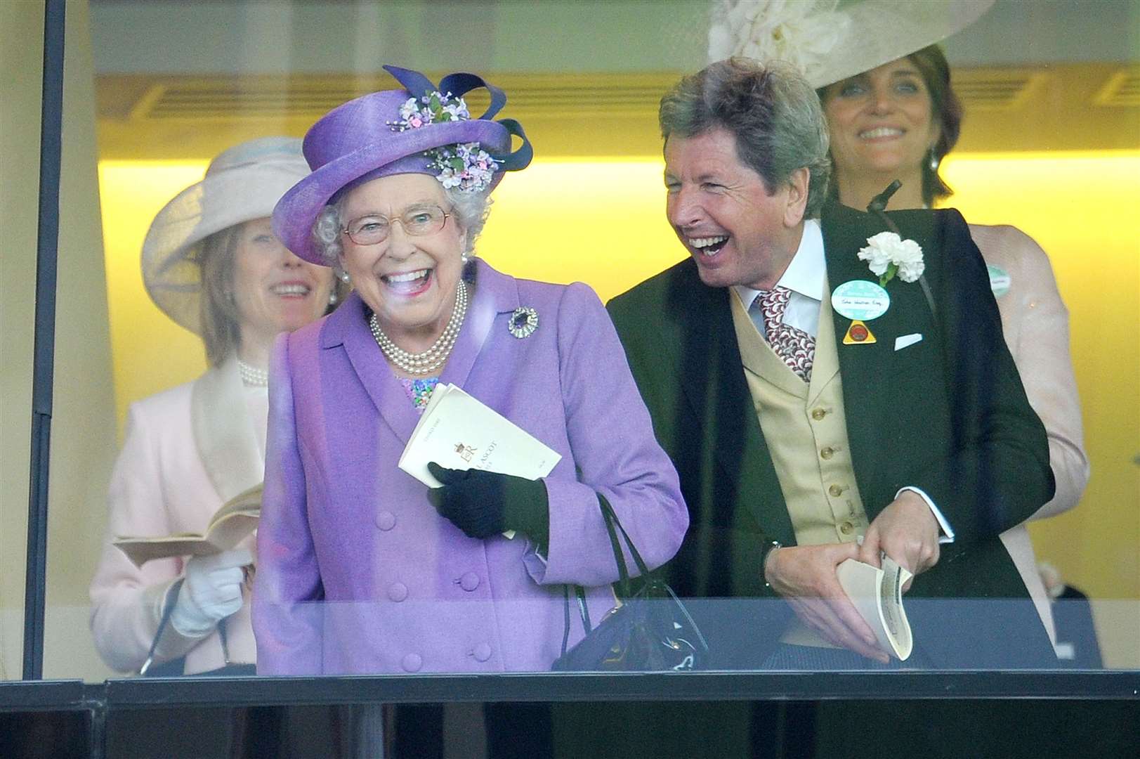 The Queen celebrating a win with her racing manager John Warren at Ascot in 2013 (Tim Ireland/PA)