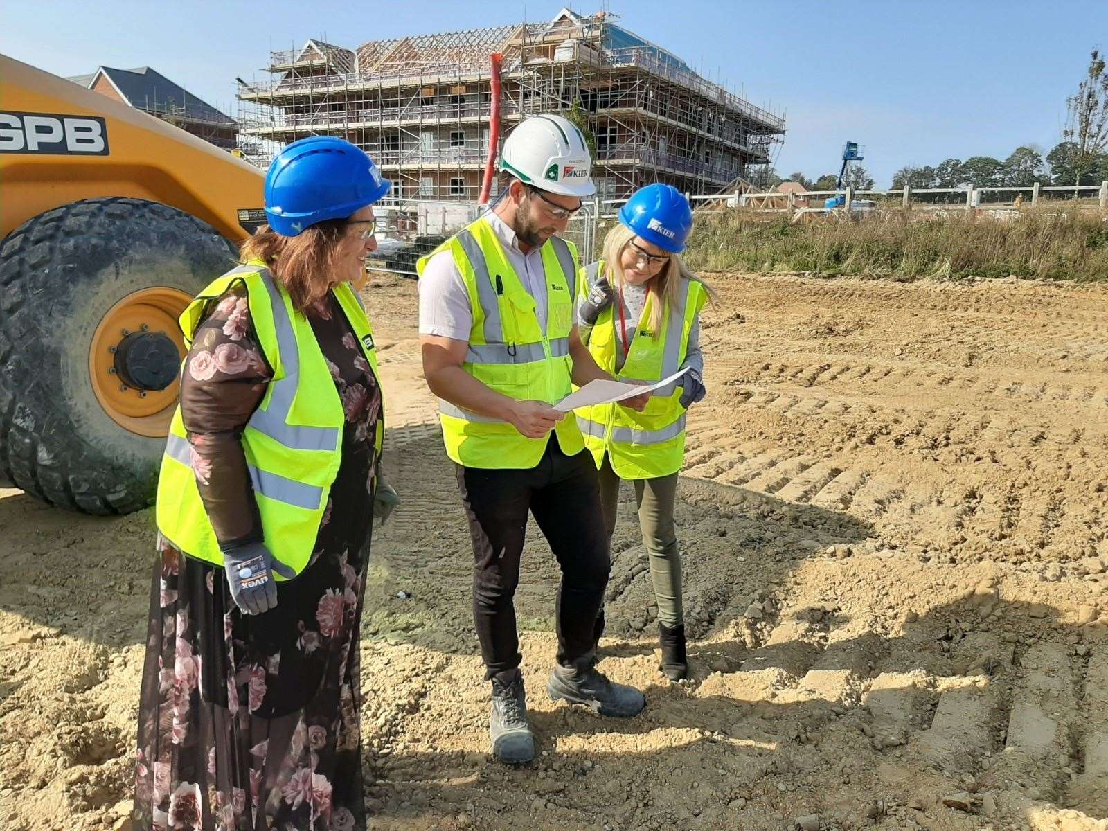 Executive head teacher Joanne Wilkinson-Tabi and head of school Kelly Garrett run through the plans with assistant site manager Kamley Robinson from builders Kier