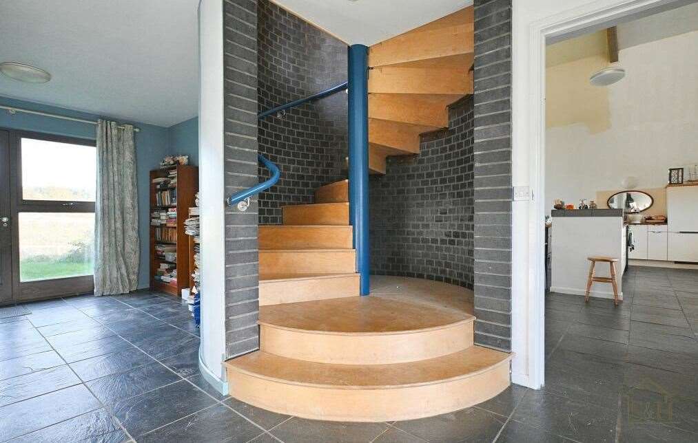 The home in Aldington features a spiral staircase