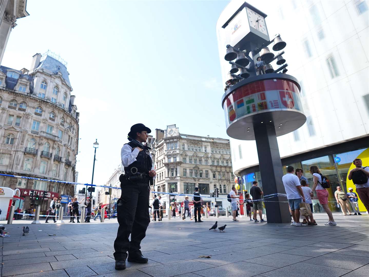 Police officers at the scene in Leicester Square (James Manning/PA)