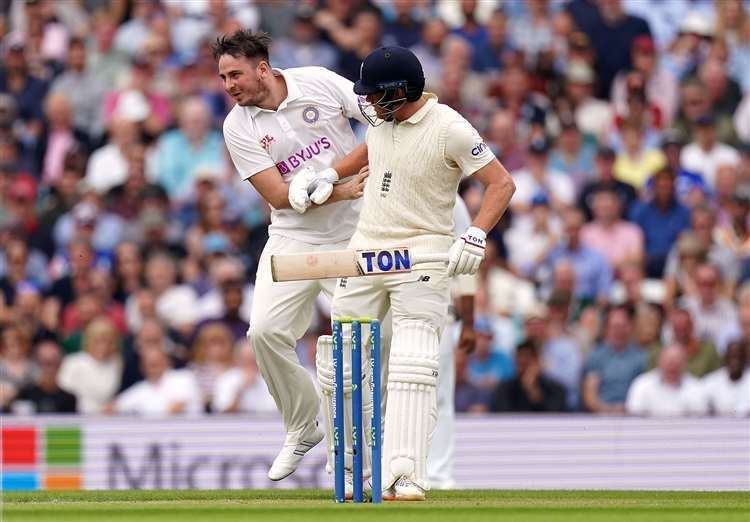 A man collides with England batsman Jonny Bairstow Photo:Adam Davy/PA