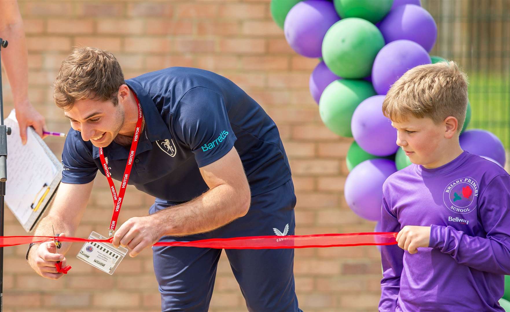 Sidelined Kent cricketer Michael Cohen cutting the ribbon to mark the launch of new sports pitches and the pavilion at Herne Bay's Briary Primary School earlier this year. Picture: Bellway