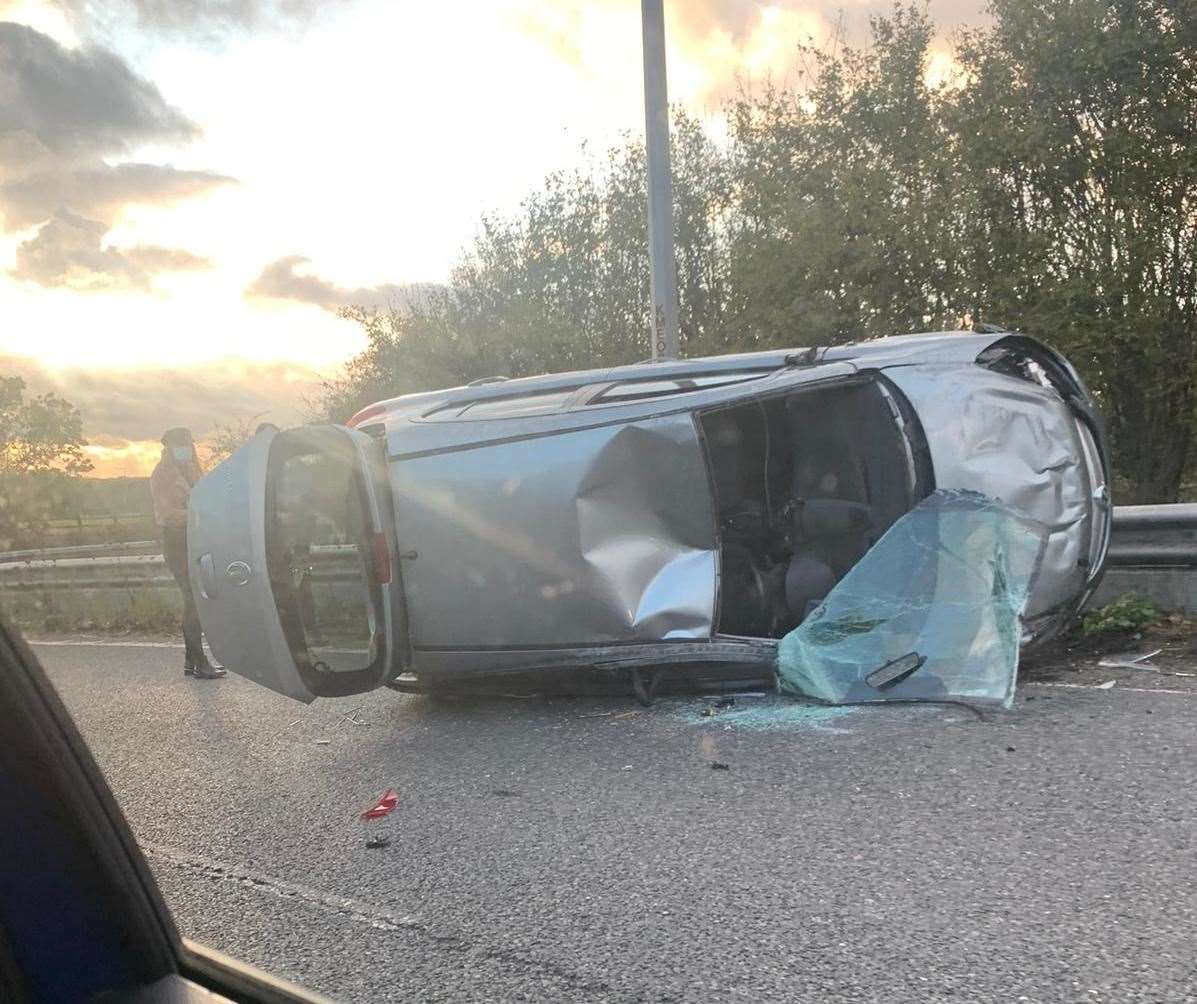 Car on its side on the M20 at junction 8 this evening. Picture: Alice Short