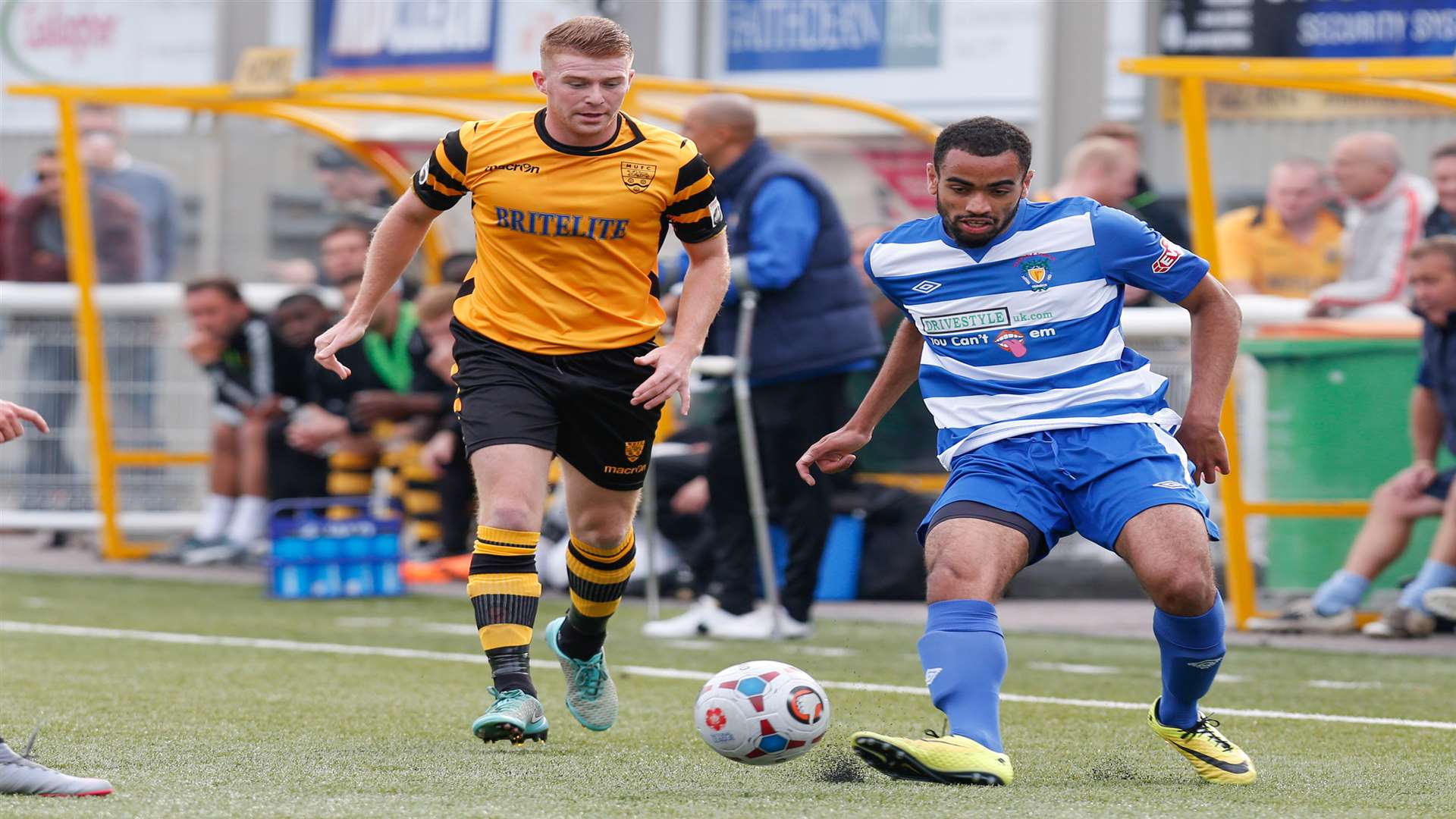 Maidstone scorer Alex Osborn chases down Dunstable's Gary Wharton Pic: Matthew Walker