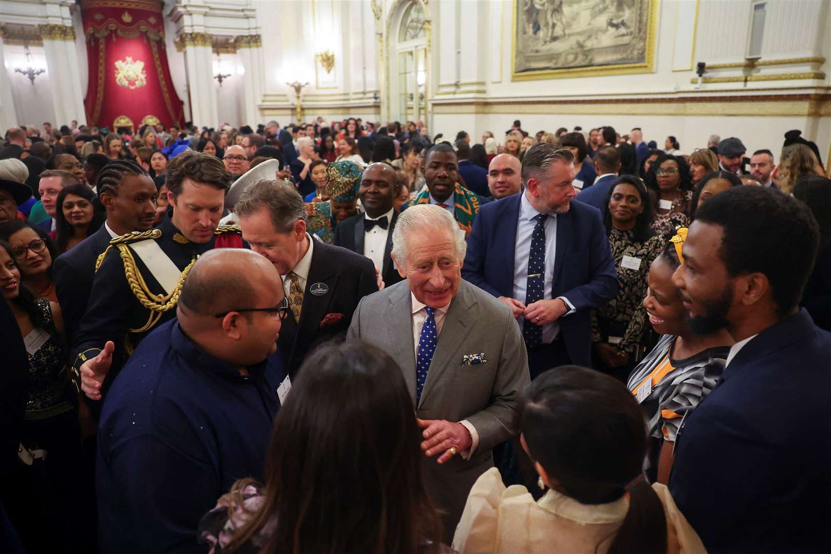 Charles speaks with guests during a reception on his 75th birthday (Toby Melville/PA)