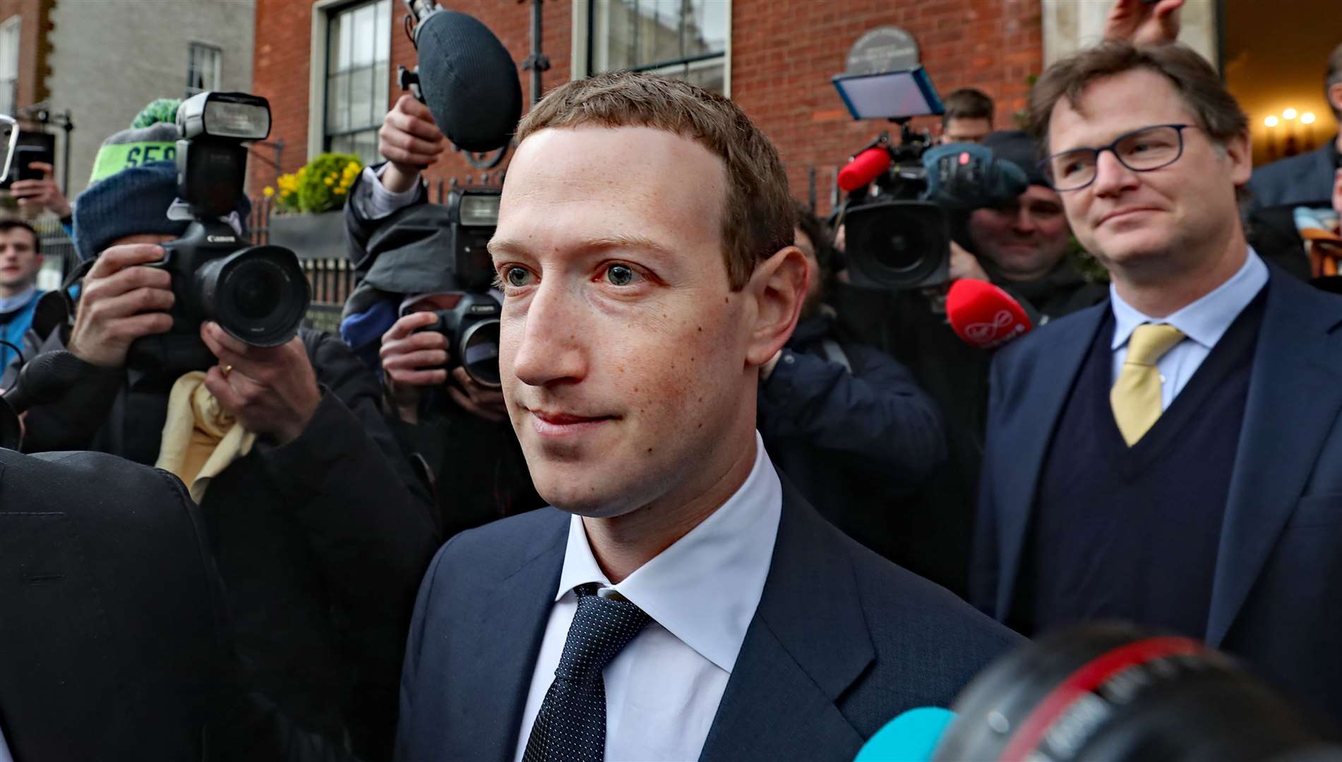 Facebook CEO Mark Zuckerberg leaving The Merrion Hotel in Dublin with head of global policy and communications Nick Clegg (Niall Carson/PA).