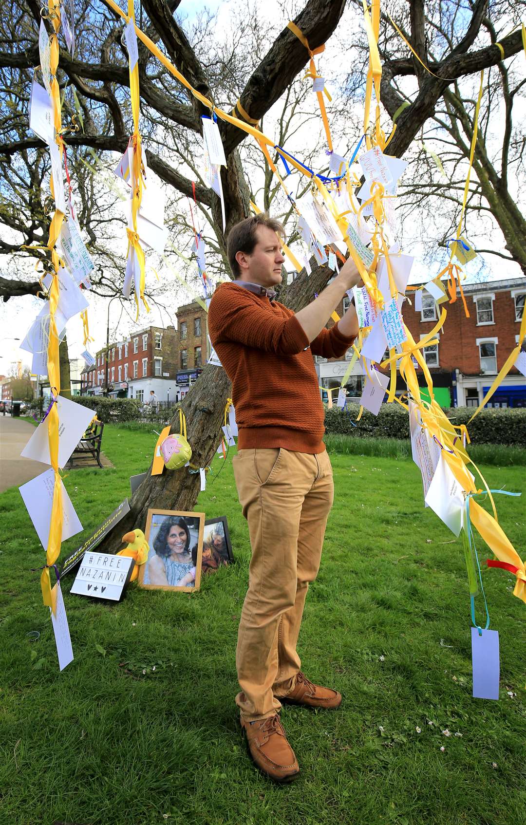 In April 2017, her husband Richard Ratcliffe, tied ribbons and messages of support to a tree in Fortune Green, West Hampstead, to mark 365 days since his wife was imprisoned in Tehran (Gareth Fuller/PA)