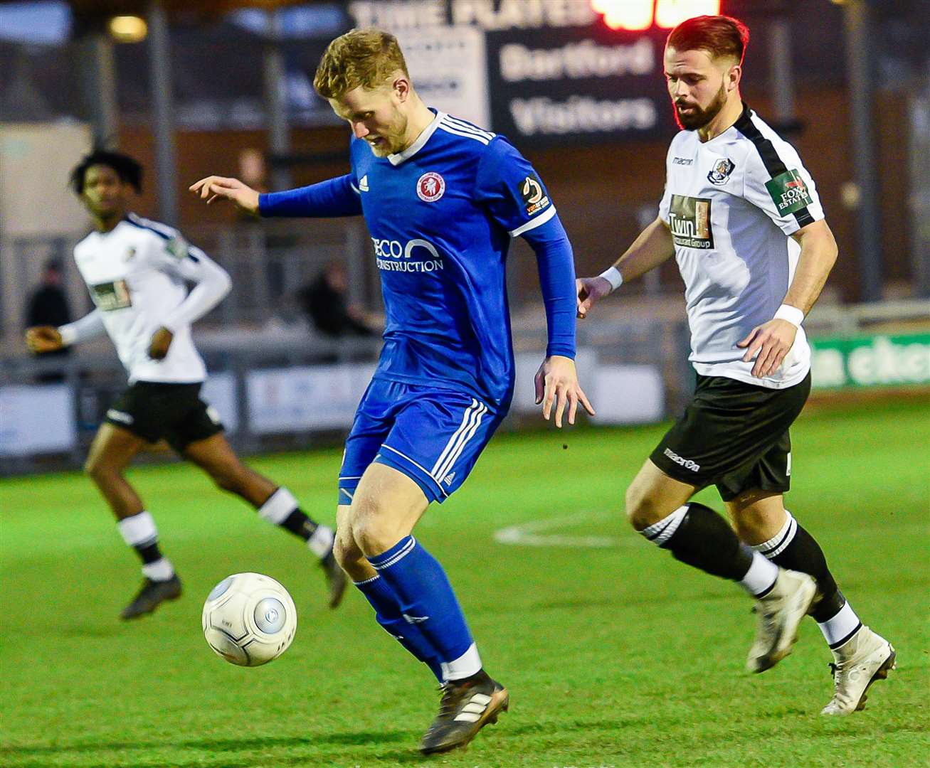 Welling's Josh Hill is closed down by Dartford's Ben Greenhalgh. Picture: Alan Langley