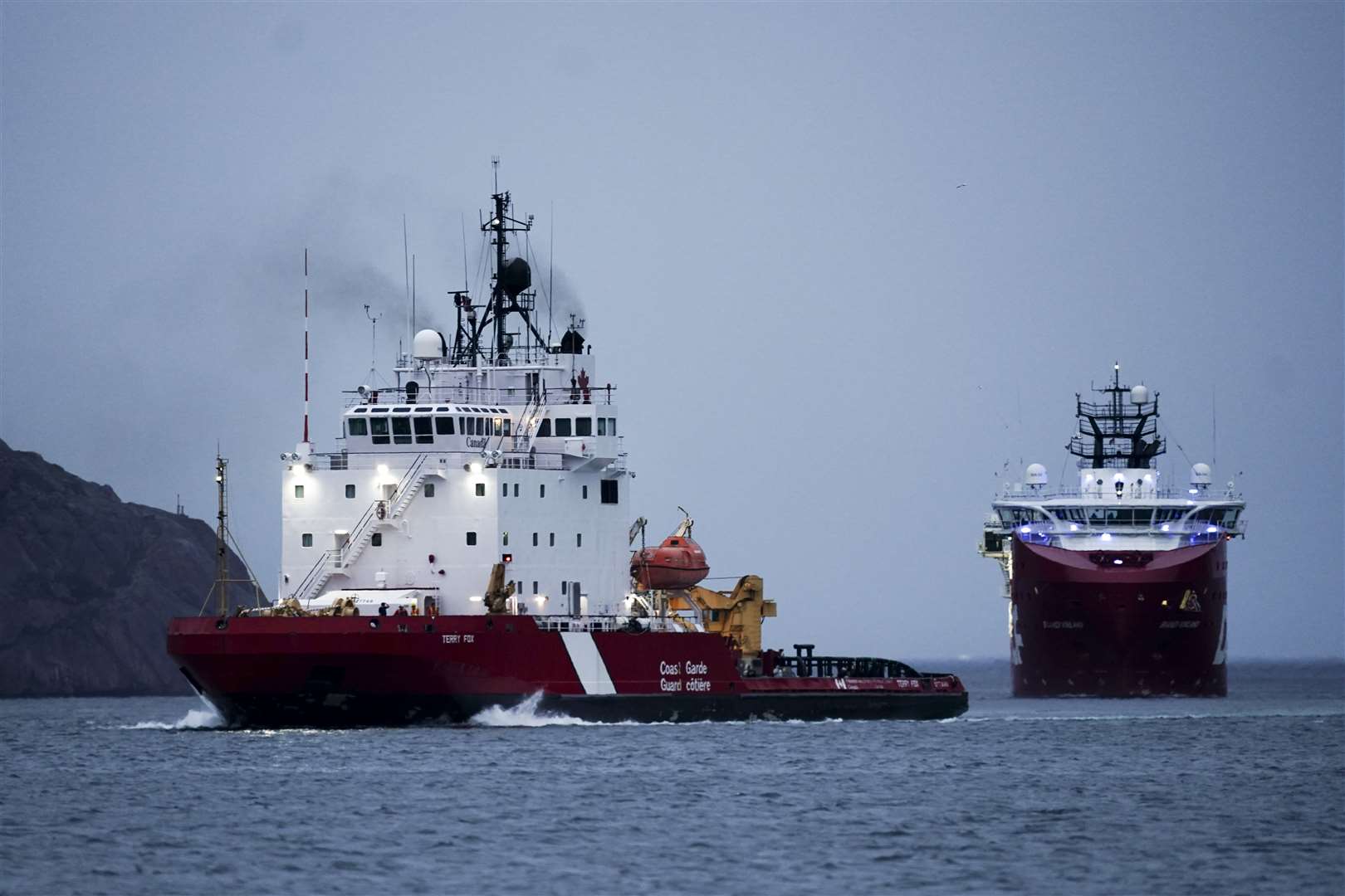 Canadian Coast Guard vessel Terry Fox and Canadian vessel Skandi Vinland return to St John’s Port in Newfoundland, Canada, after supporting the search and rescue operation (Jordan Pettitt/PA)