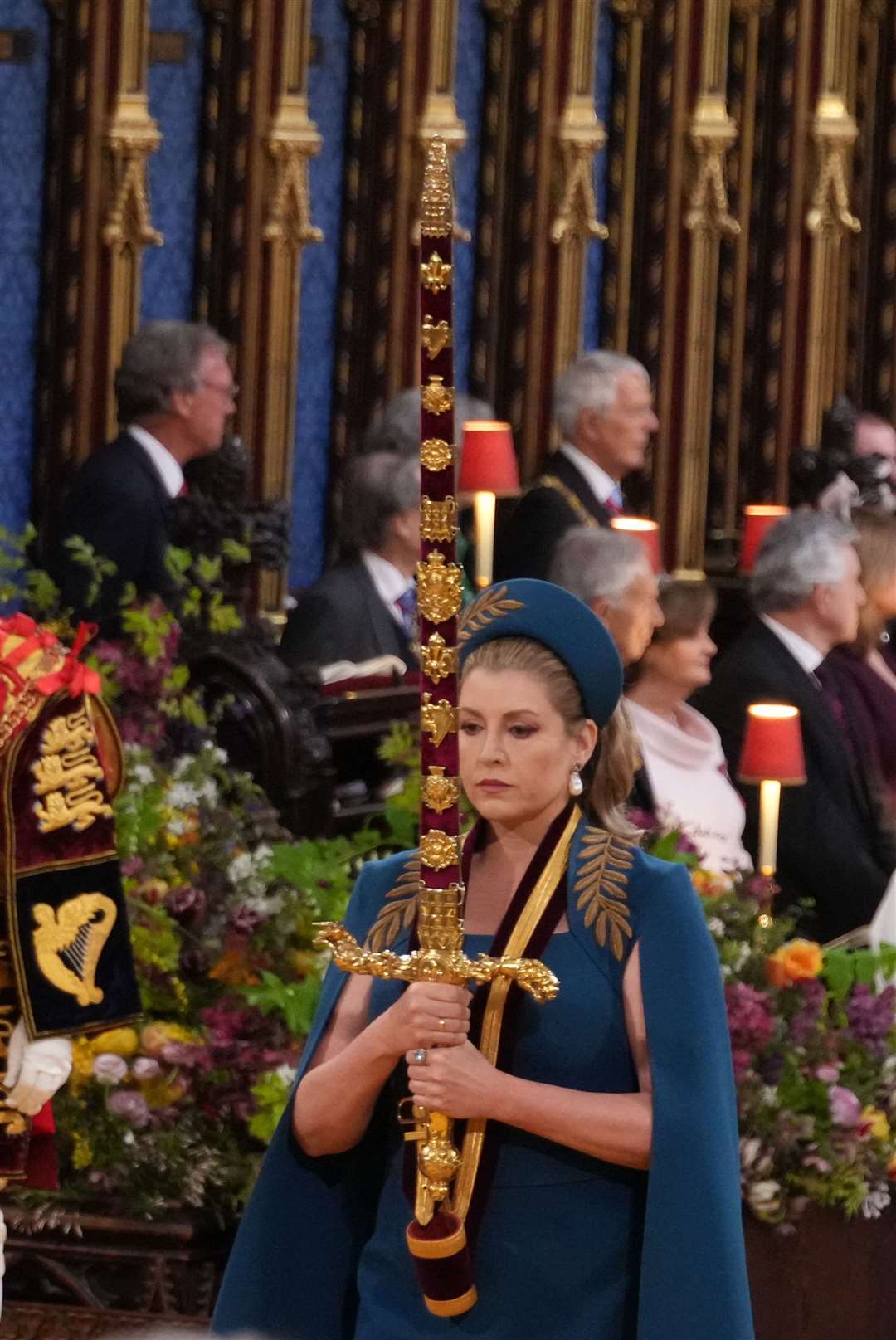 Lord President of the Council, Penny Mordaunt, carrying the Sword of State, in the procession during the coronation (Victoria Jones/PA)