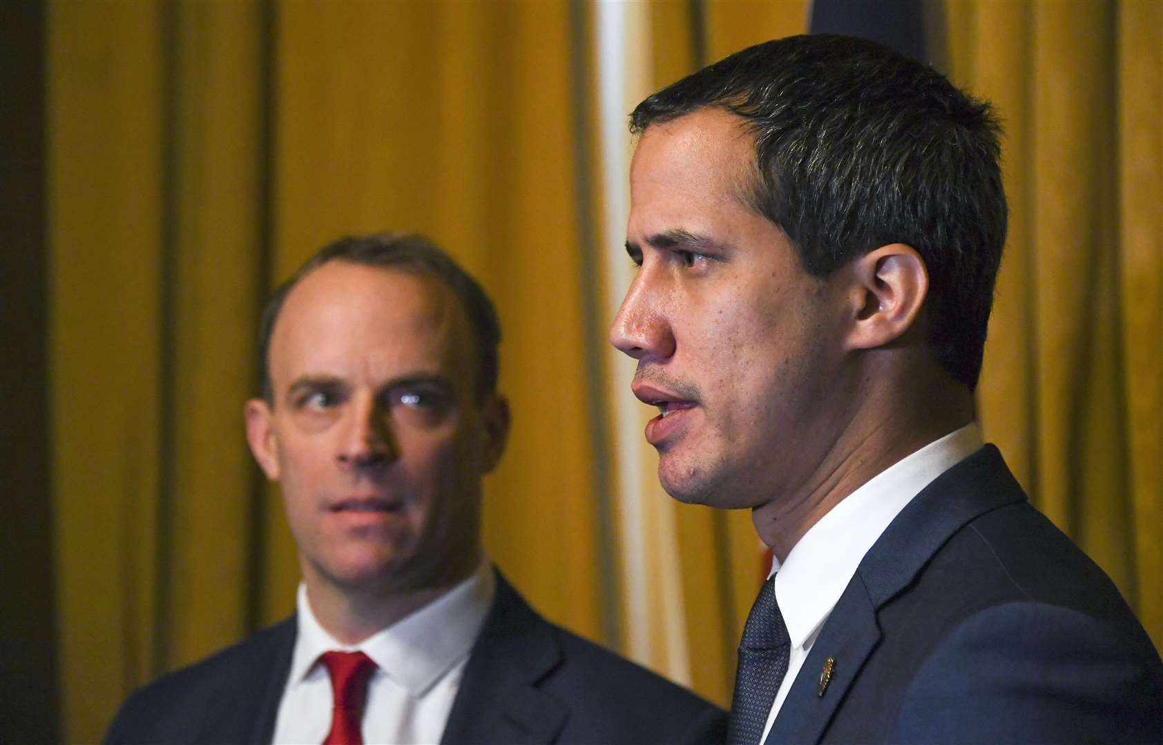 Venezuelan opposition leader Juan Guaido (right) meeting Foreign Secretary Dominic Raab meeting at the Foreign Office in London for talks in January (PA/Alberto Pezzali)