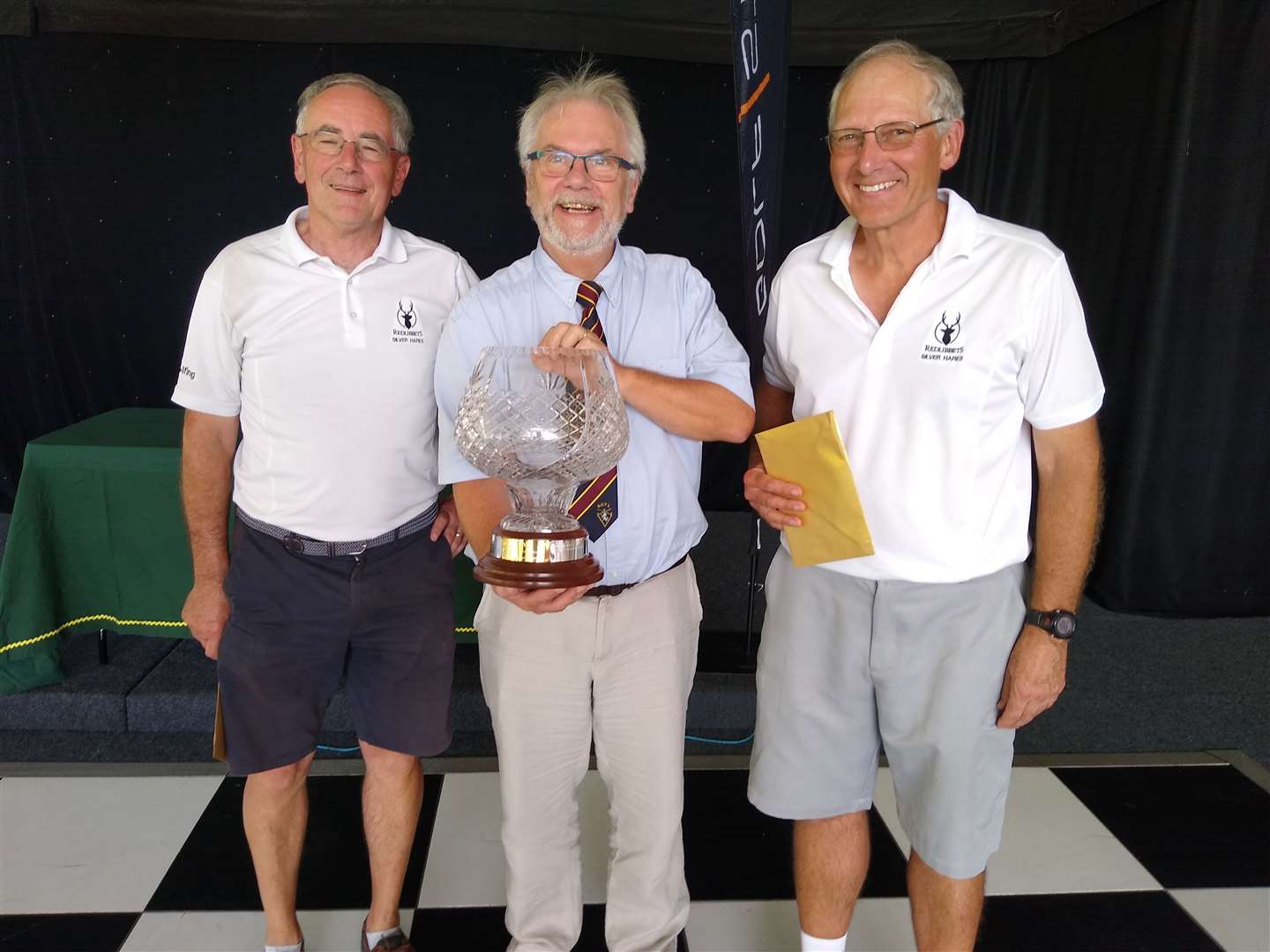 League sponsor Derek Richford of Golfstream Trolleys presenting Andy Burton and David Fowler of Redlibbets with the Pairs Championship Trophy