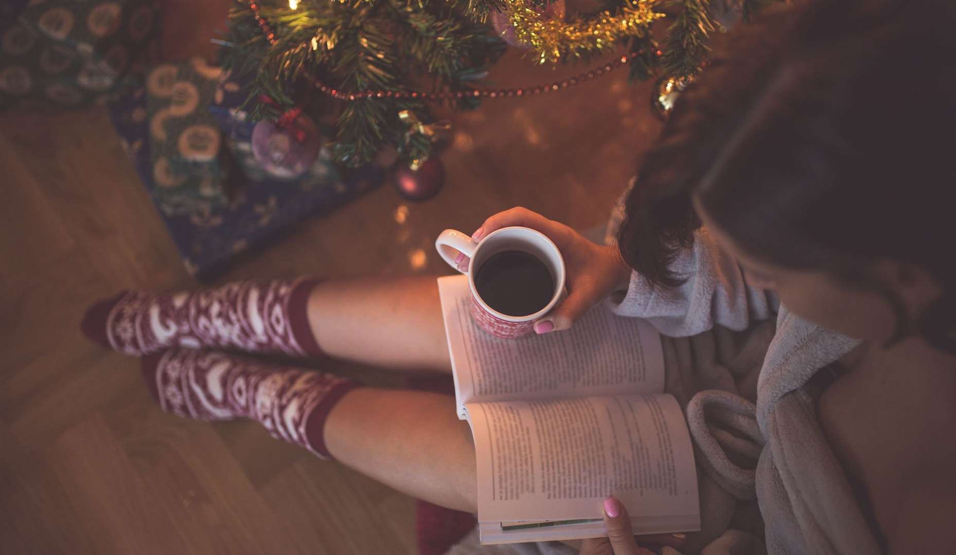 Give someone the gift of cosying up with a good book this Christmas. Picture: iStock