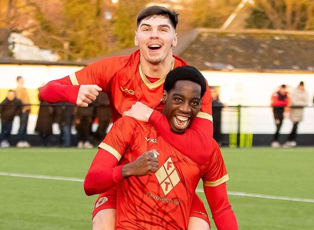 Whitstable’s Ronald Sithole celebrates his hat-trick with Harvey Smith. Picture: Les Biggs